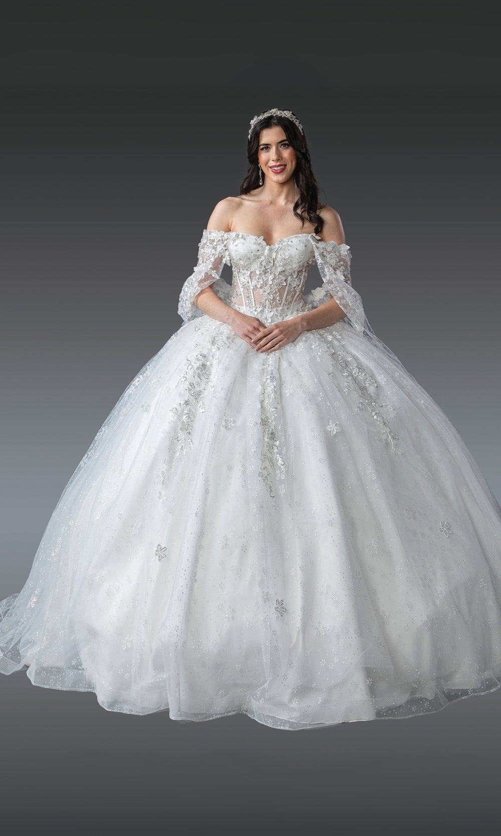 Woman wearing a white wedding dress on a gray background