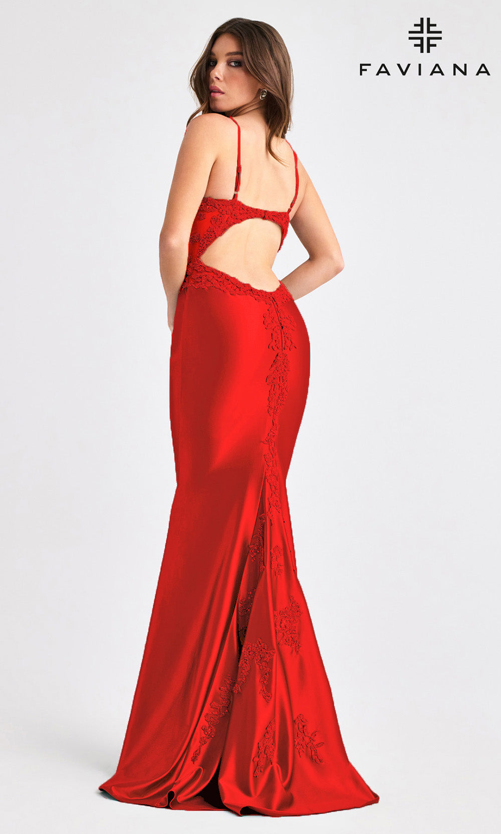 Red evening gown with cut-out design on a white background, featuring the Faviana brand.