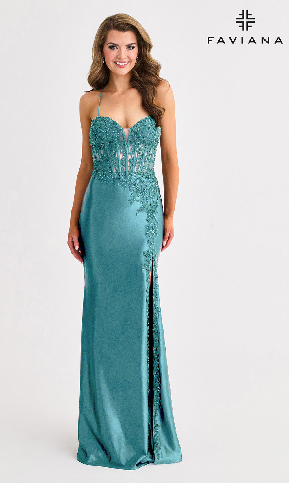 Teal evening gown with lace detailing on a white background, featuring the Faviana brand.