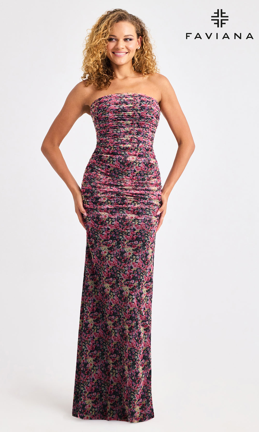 Woman wearing a floral strapless gown with Faviana branding on a white background