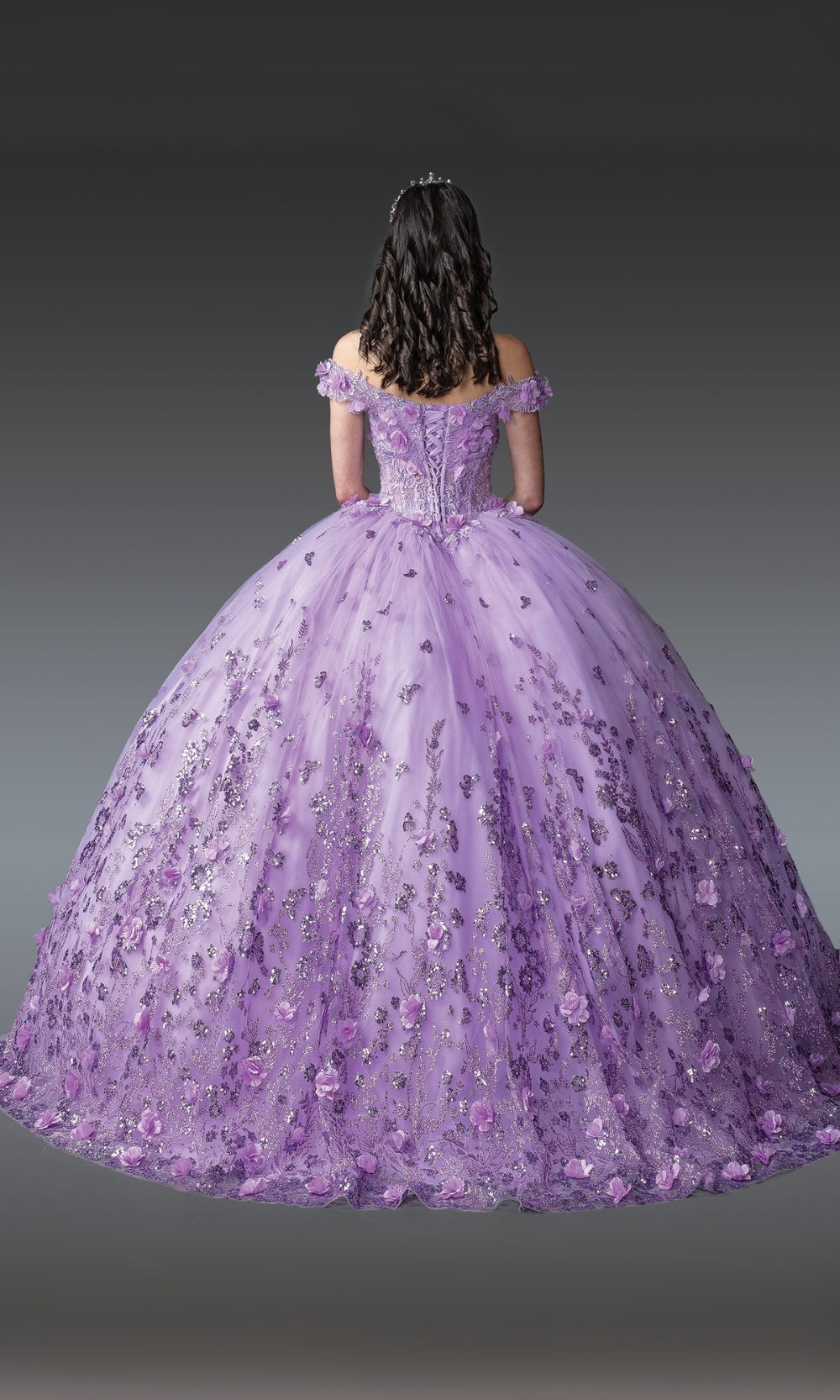Purple ball gown with floral details on a gray background