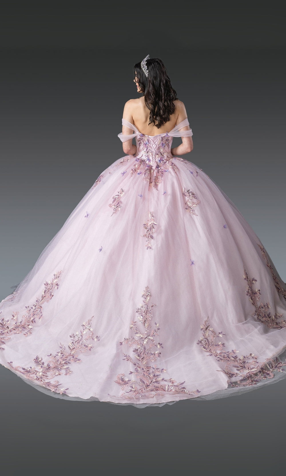 Pink wedding dress with floral embroidery on a dark background