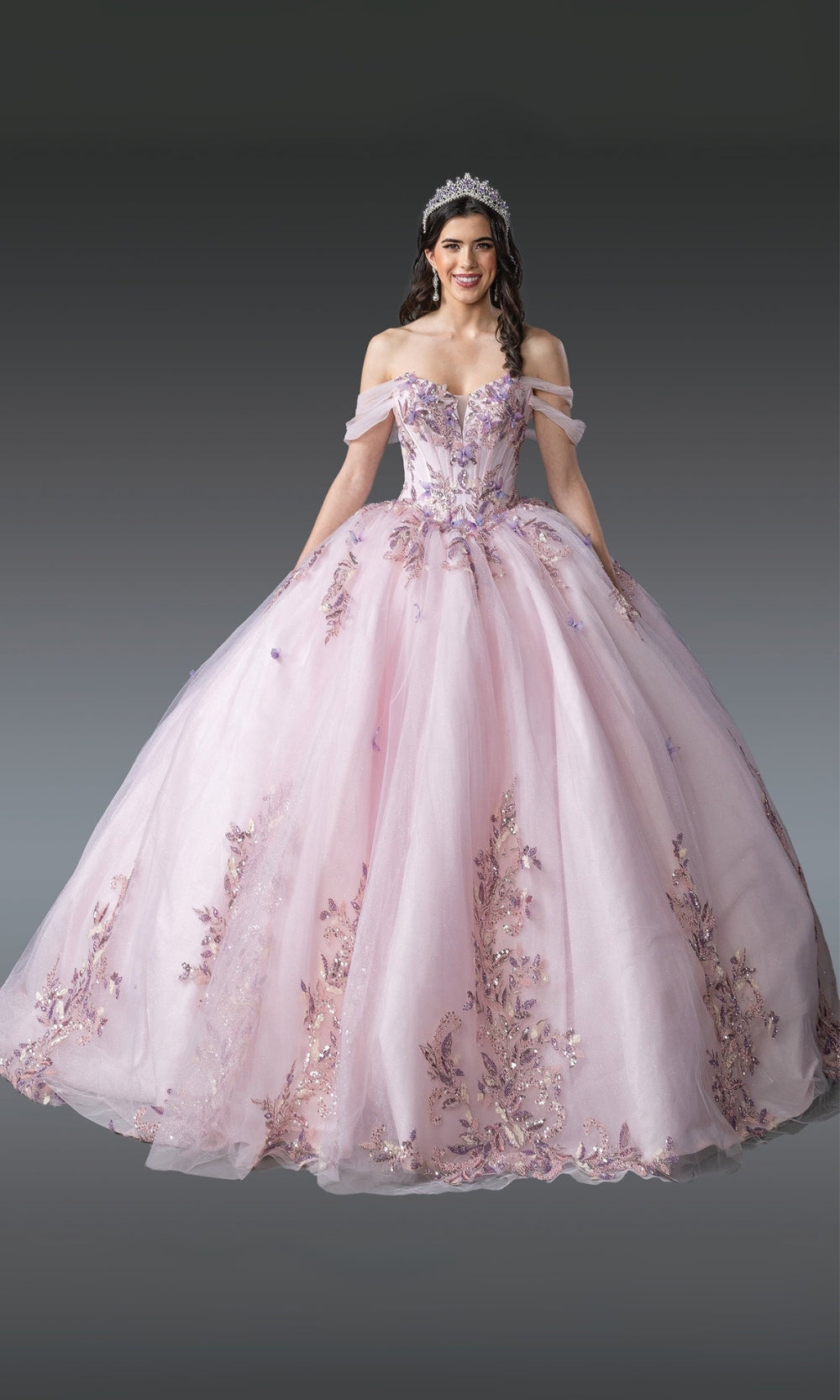 Pink ball gown with floral embroidery on a gray background
