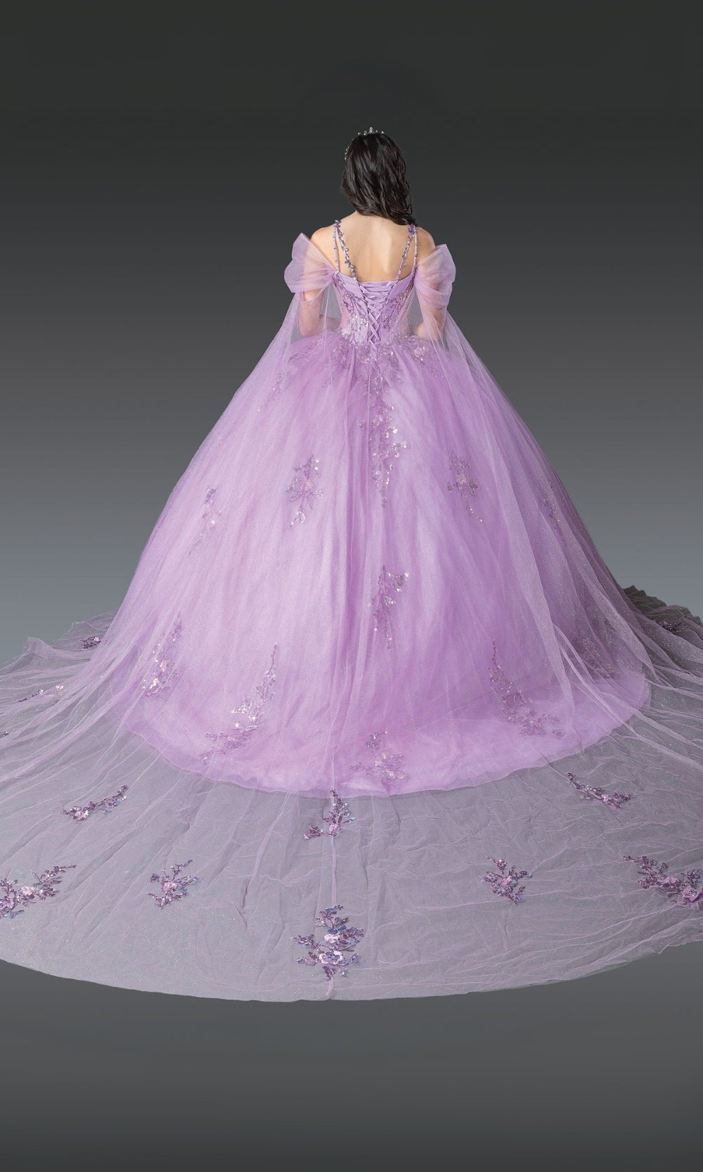 Purple ball gown with floral details on a plain background