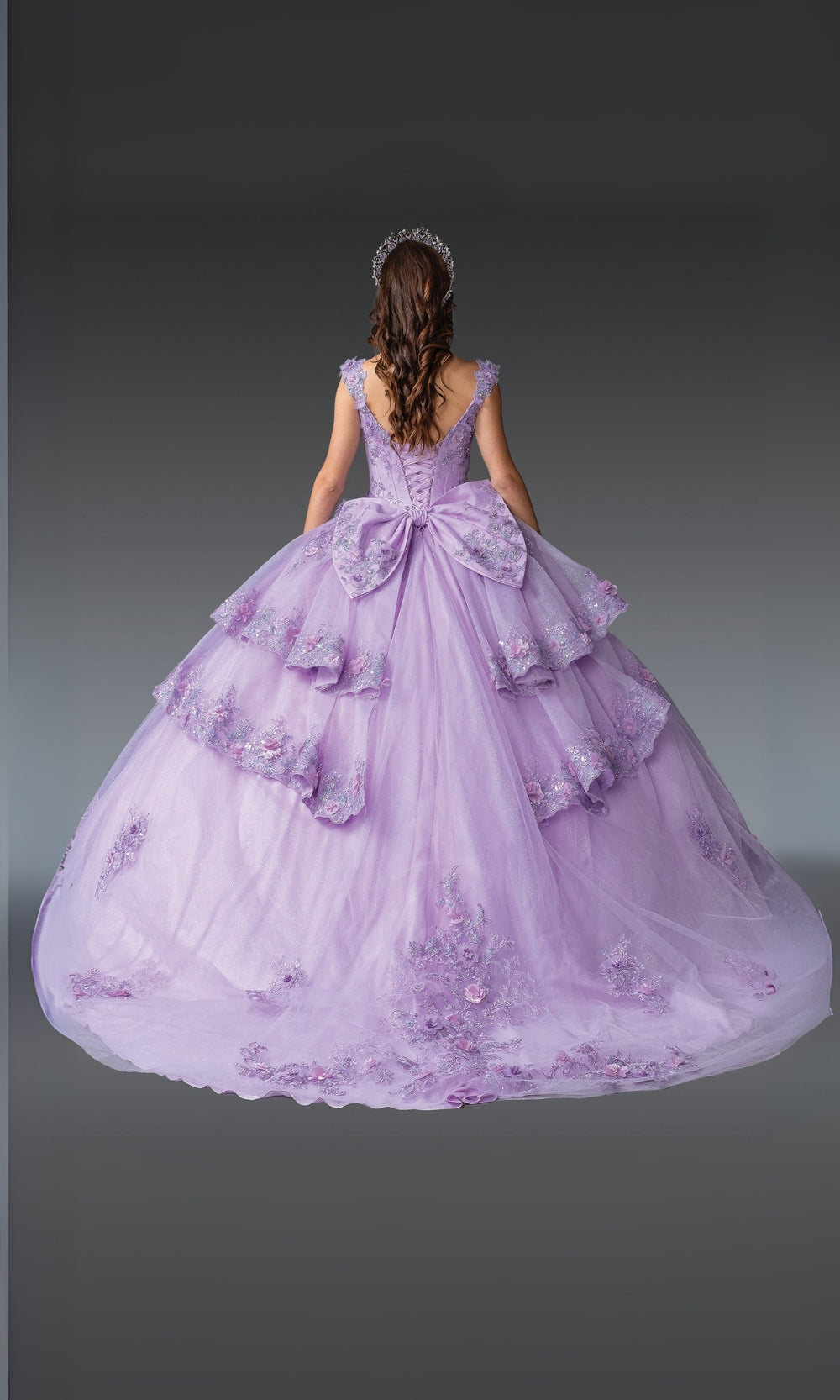 Purple ball gown with floral details on a gray background