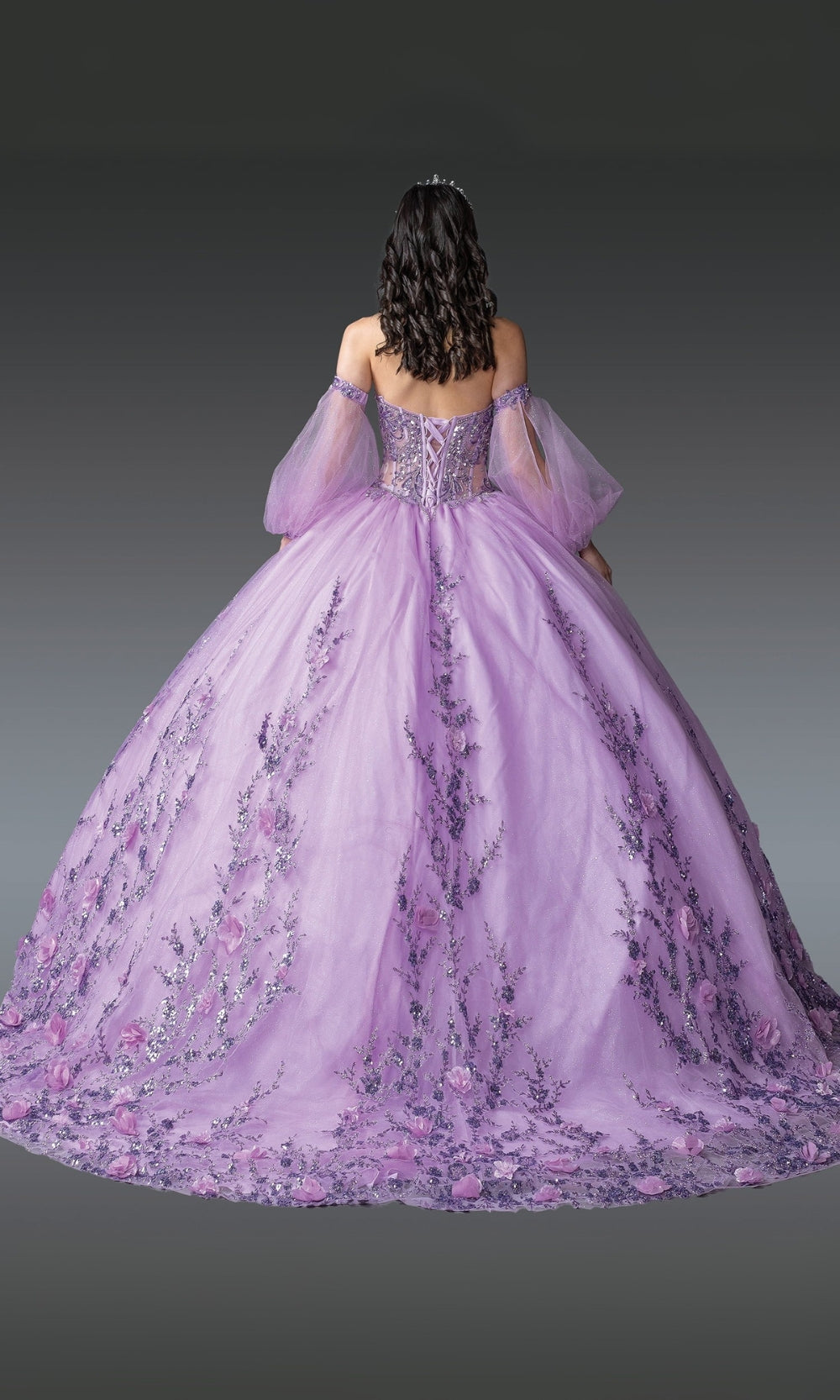 Purple ball gown with floral details on a dark background