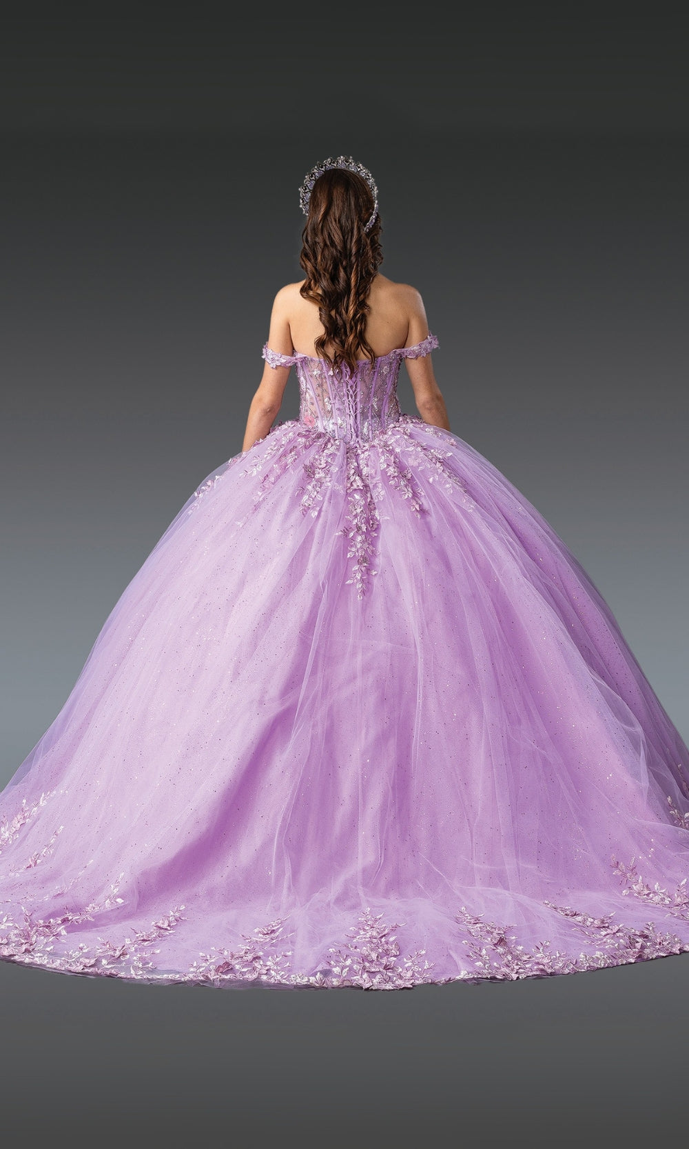 Purple ball gown with floral details on a dark background