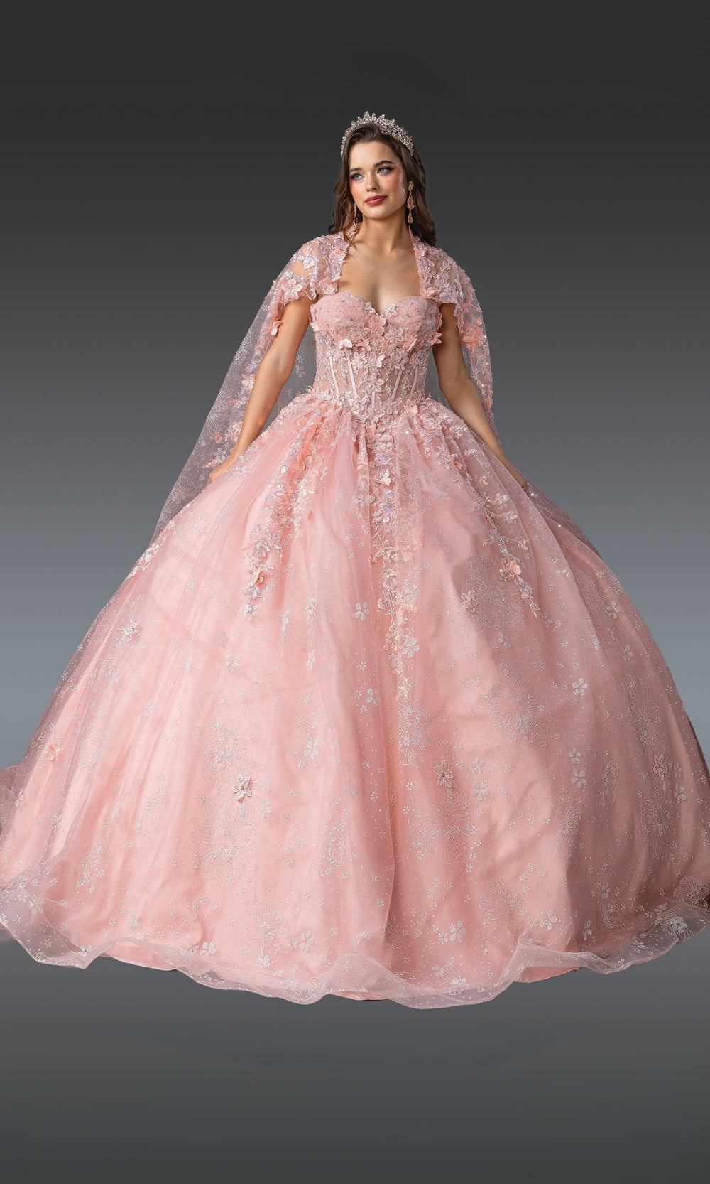 Pink ball gown with floral details on a gray background