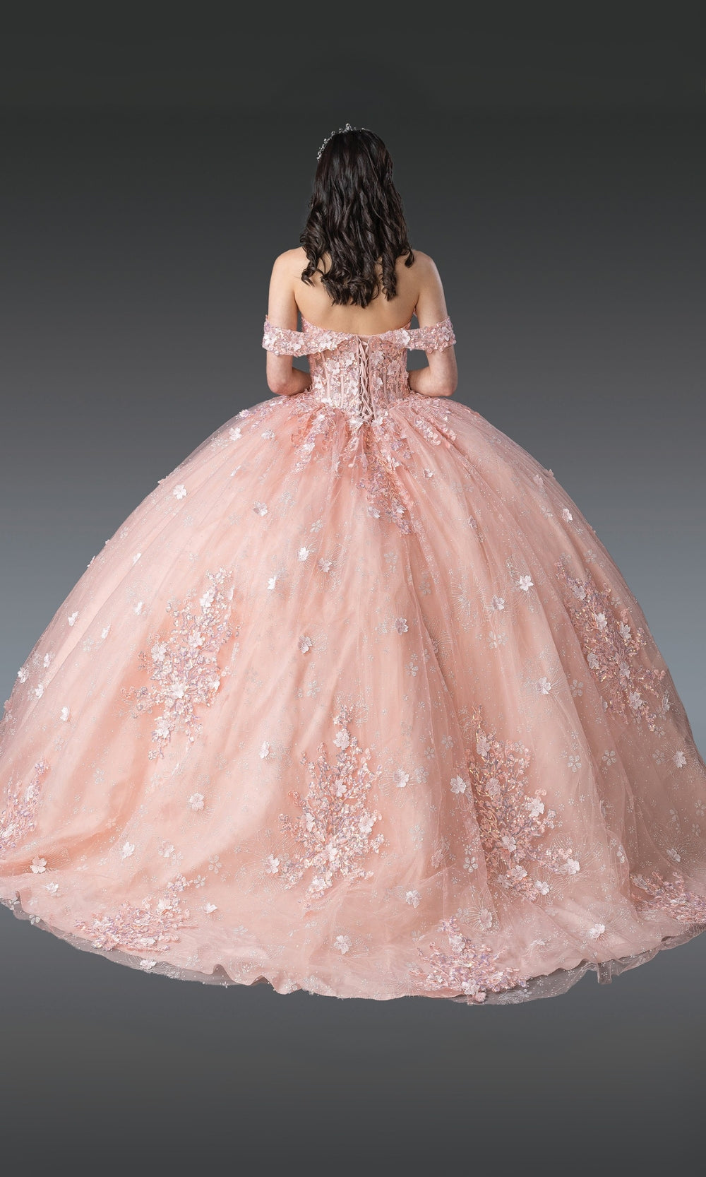 Pink ball gown with sequin details on a plain background