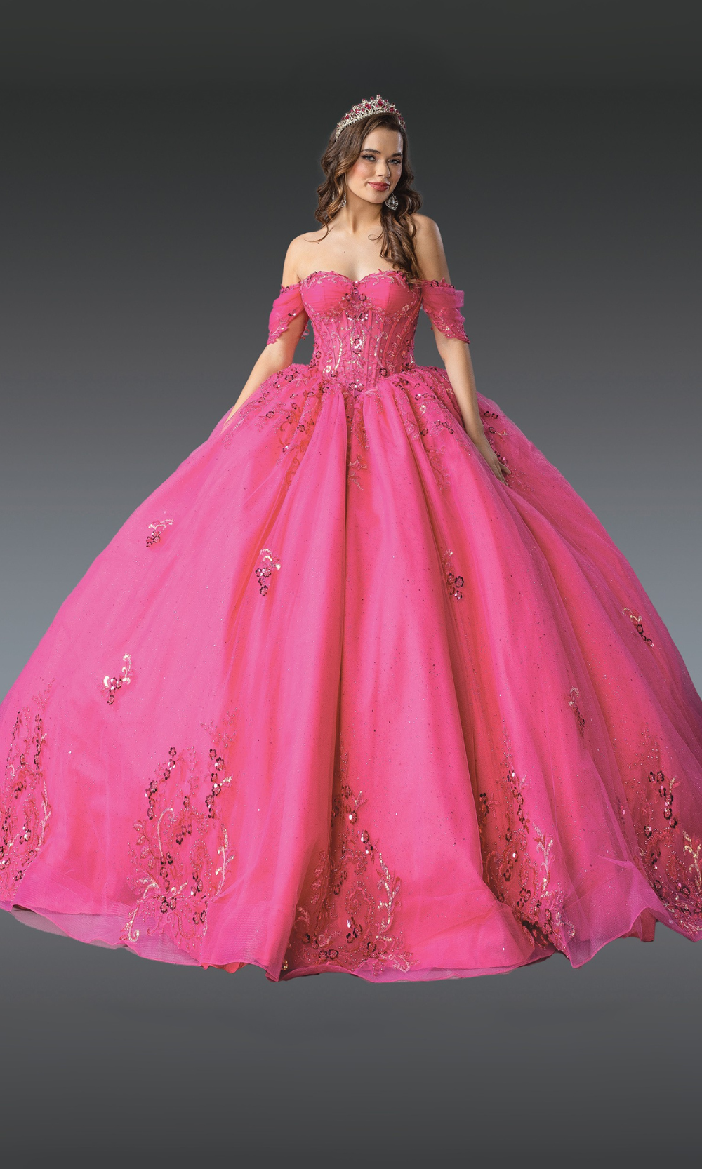 Pink ball gown with floral embroidery on a gray background