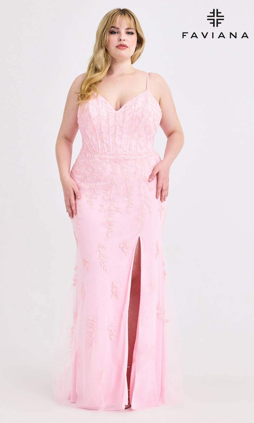 Woman wearing a pink evening gown with a visible brand logo on a white background