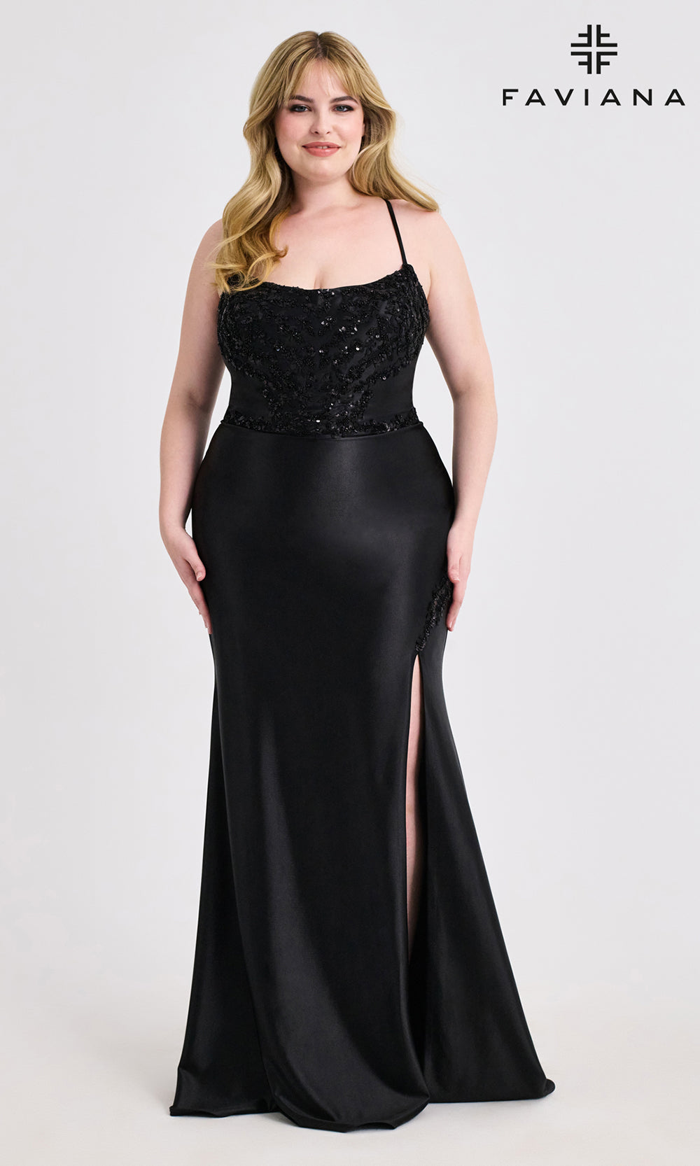 Woman wearing a black evening gown with sequin top on a white background, branded 'Faviana'.