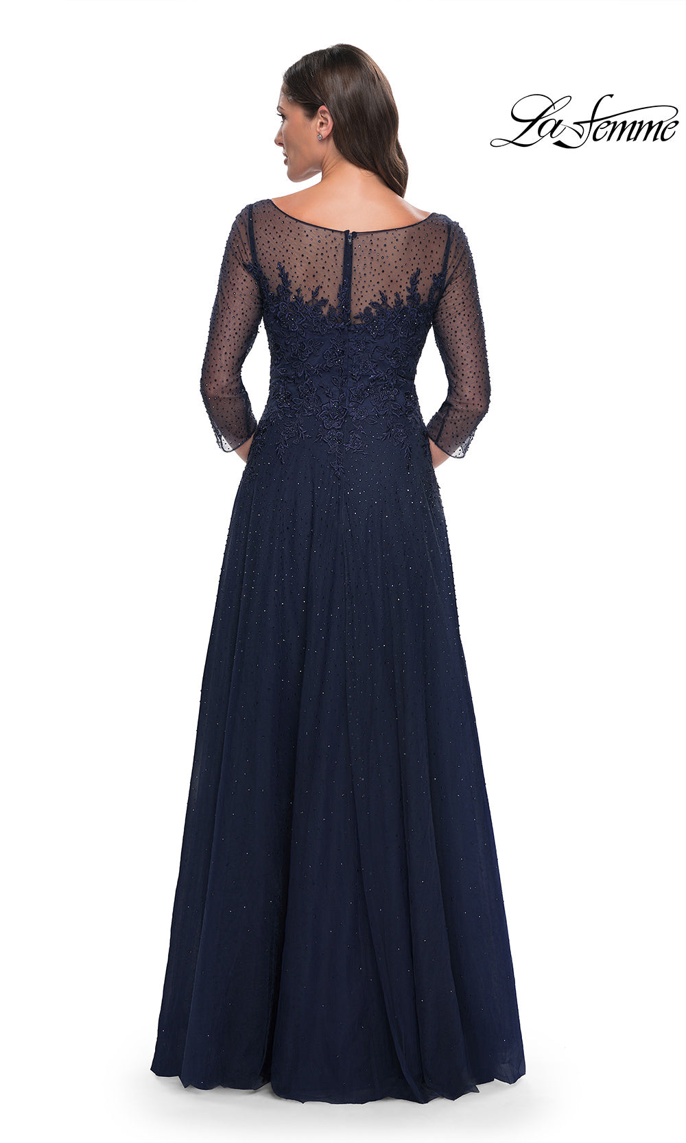 Navy blue evening gown with lace detailing on a white background