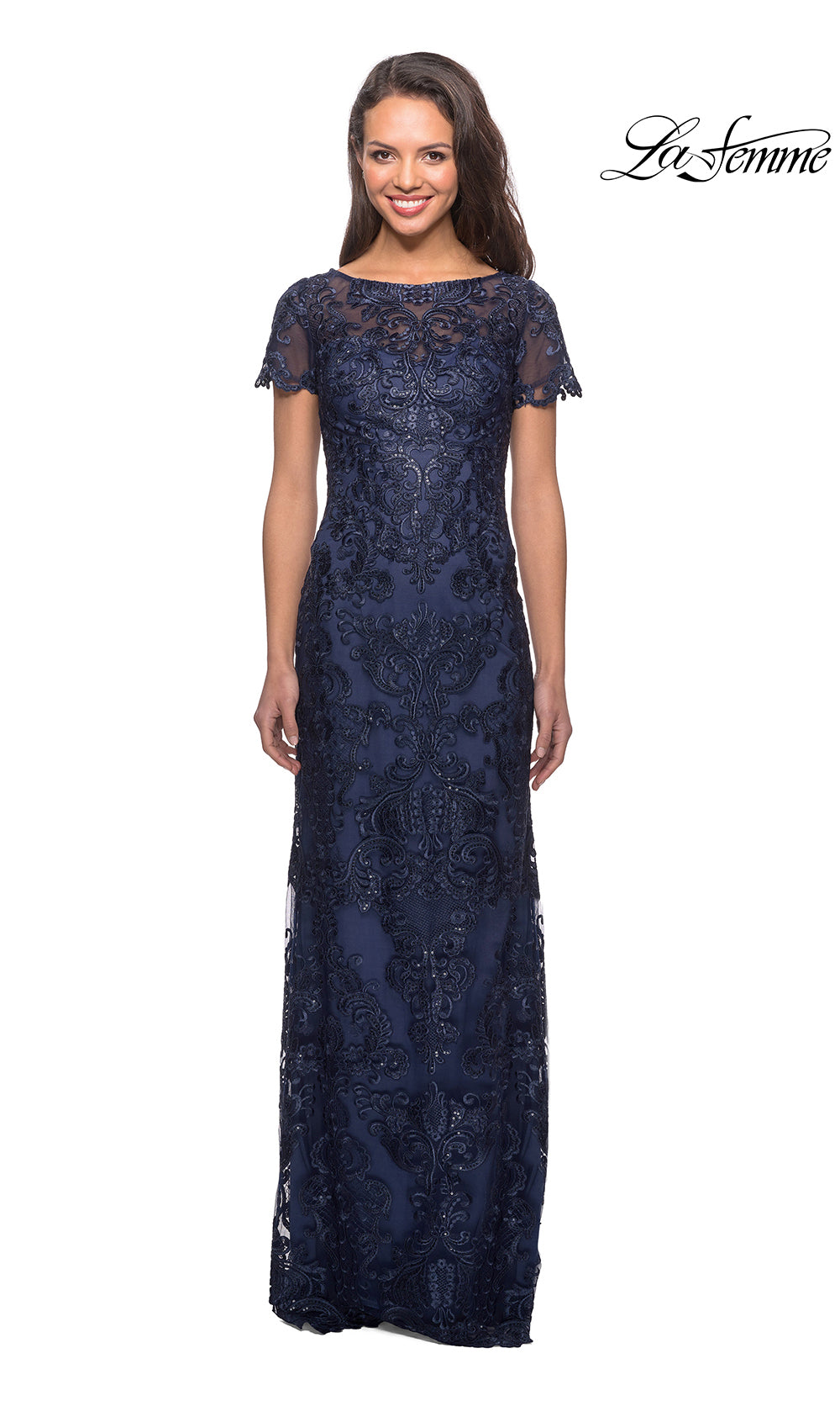 Woman wearing a navy lace dress on a white background with 'La Femme' branding.