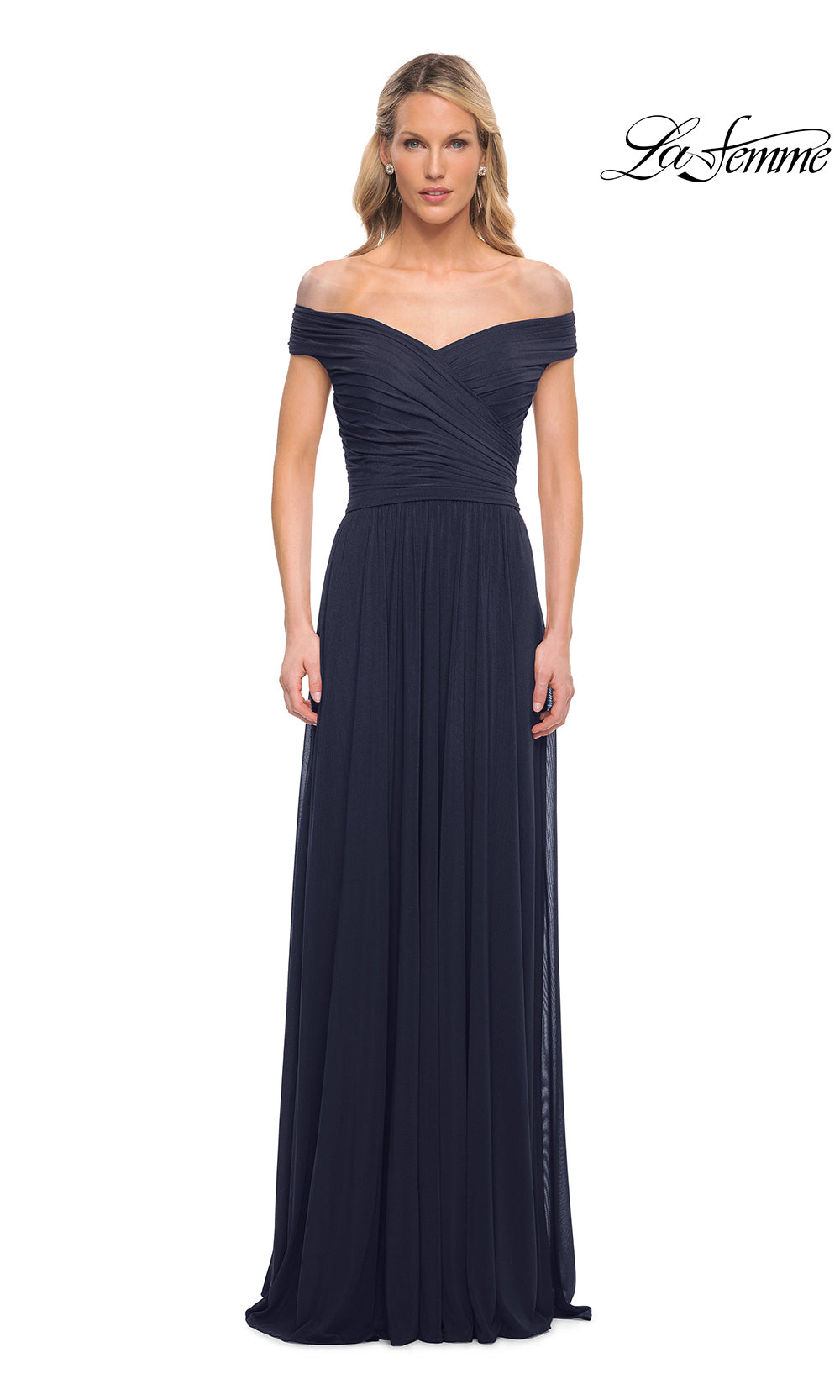 Woman wearing a navy off-shoulder gown on a white background with 'La Femme' branding.