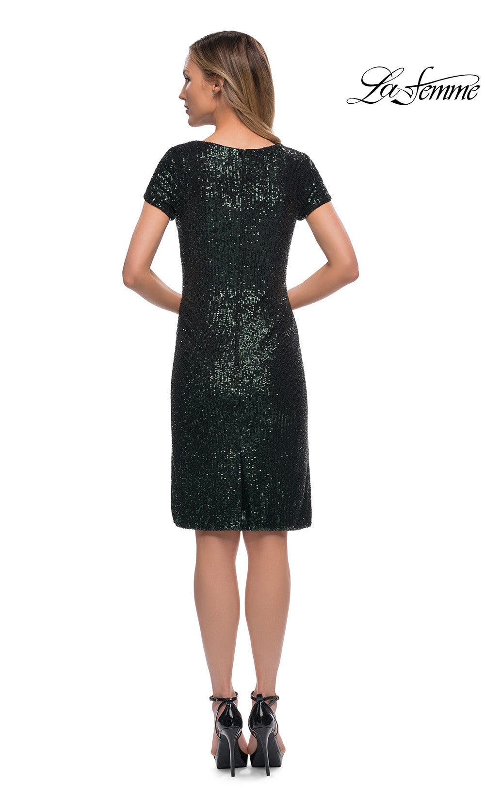 Black sequin dress worn by a model on a white background