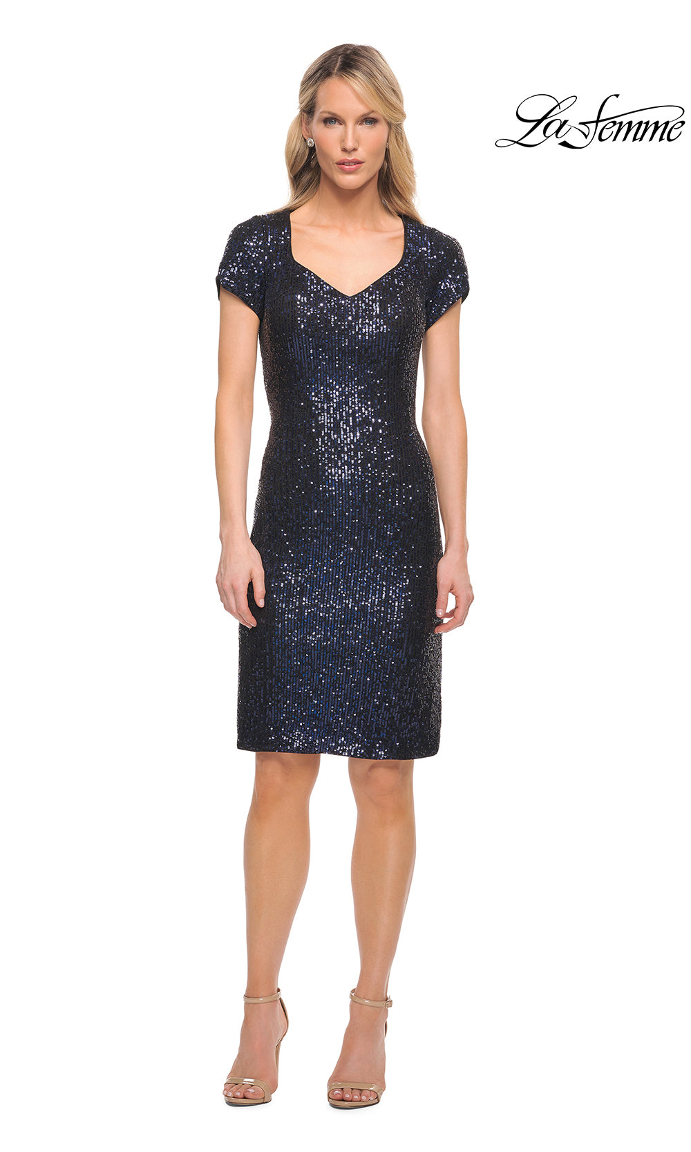 Woman wearing a navy sequin dress on a white background