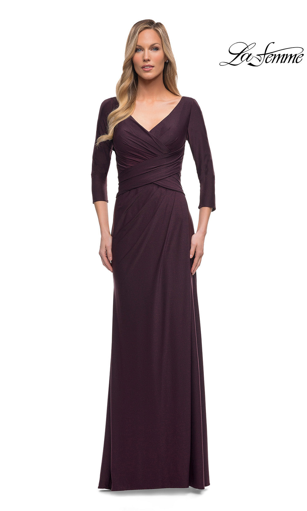 Woman wearing a long burgundy dress with a V-neck and three-quarter sleeves on a white background.