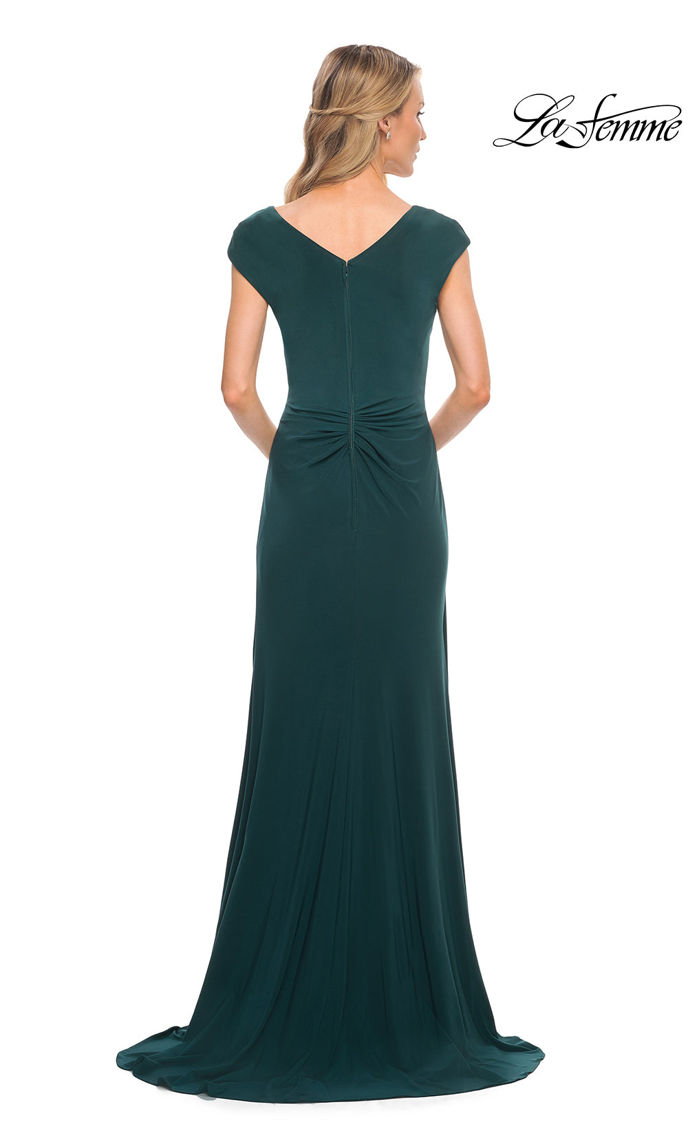 Green evening gown with a bow detail on a white background