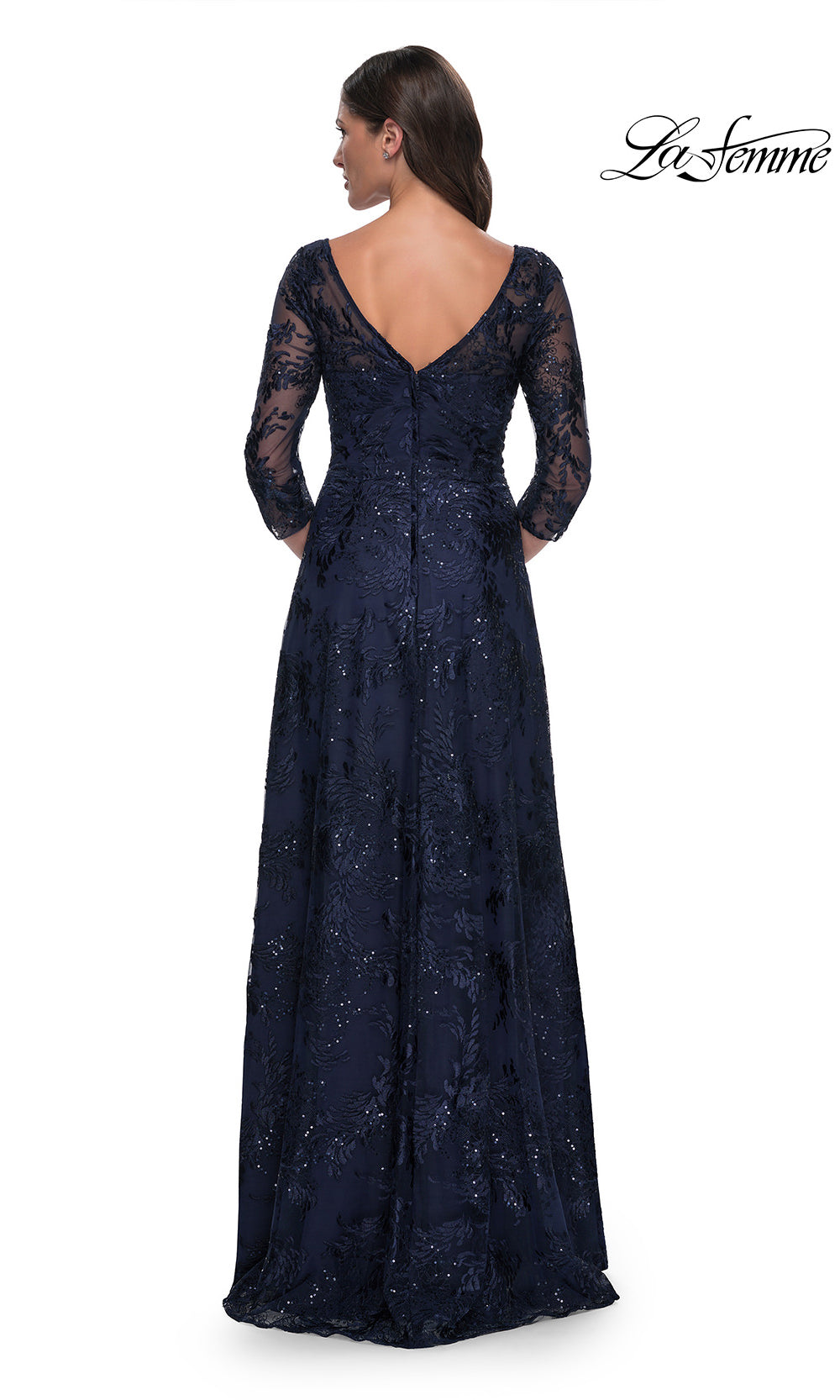 Navy blue evening gown with long sleeves and lace details on a white background, brand 'La Femme' visible.