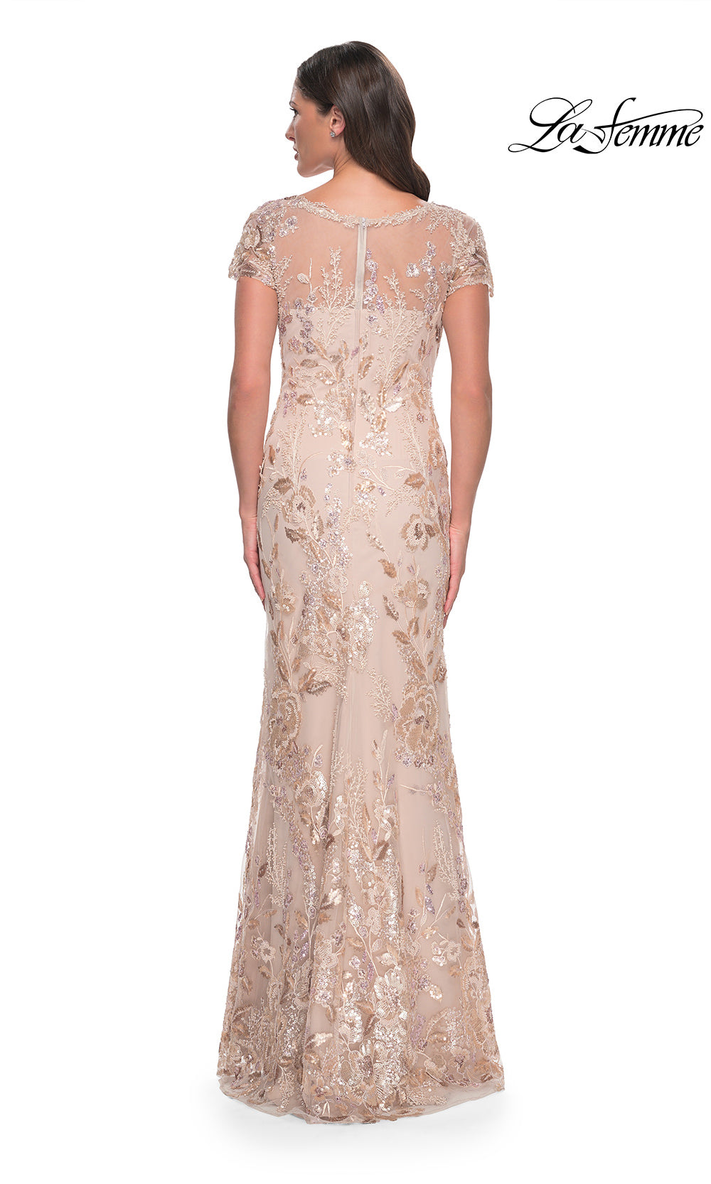 Woman wearing a long, elegant dress with lace details on a white background, branded 'La Femme'.