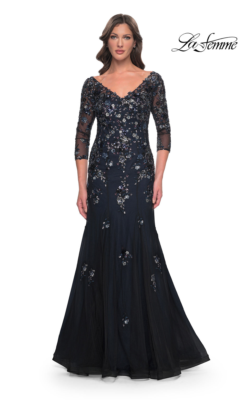 Navy evening gown with floral embellishments on a white background