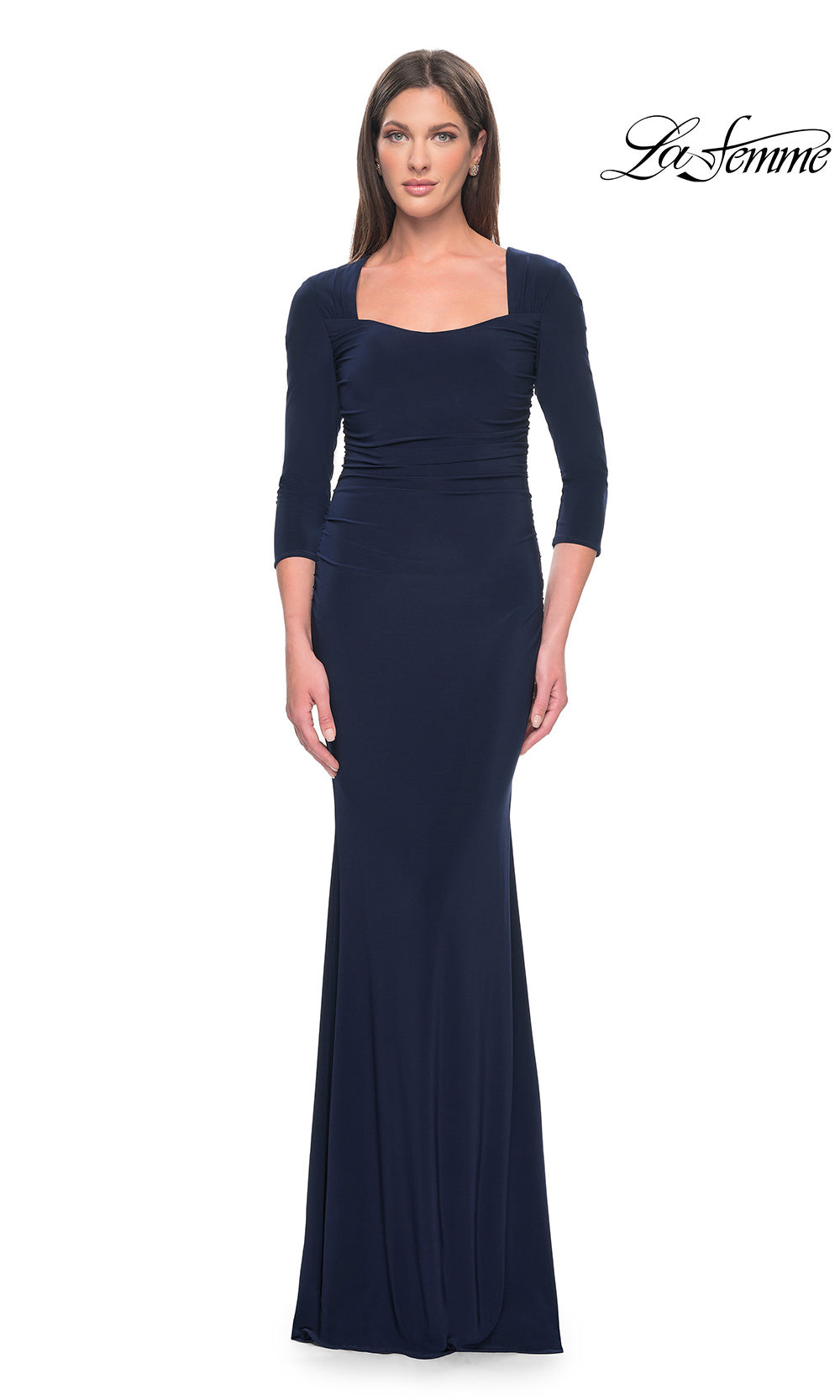 Woman wearing a navy blue evening gown on a white background with 'La Femme' branding.