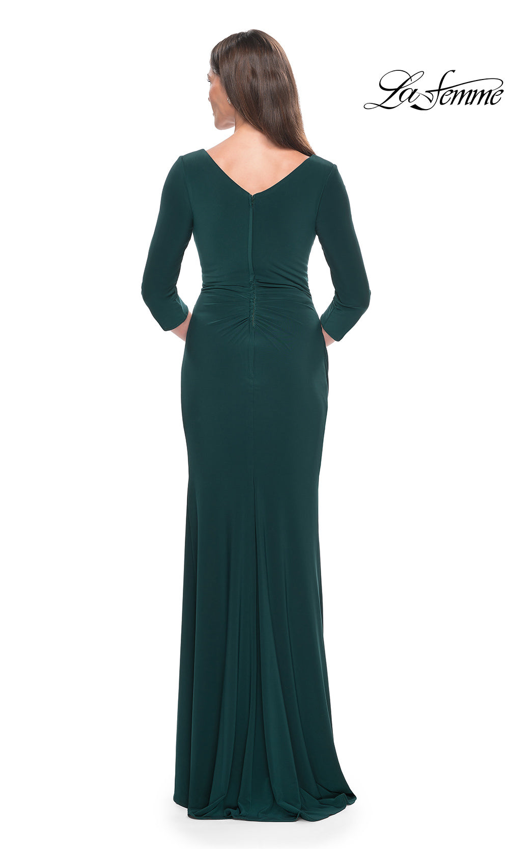 Green evening gown with long sleeves on a white background, brand 'La Femme' visible.