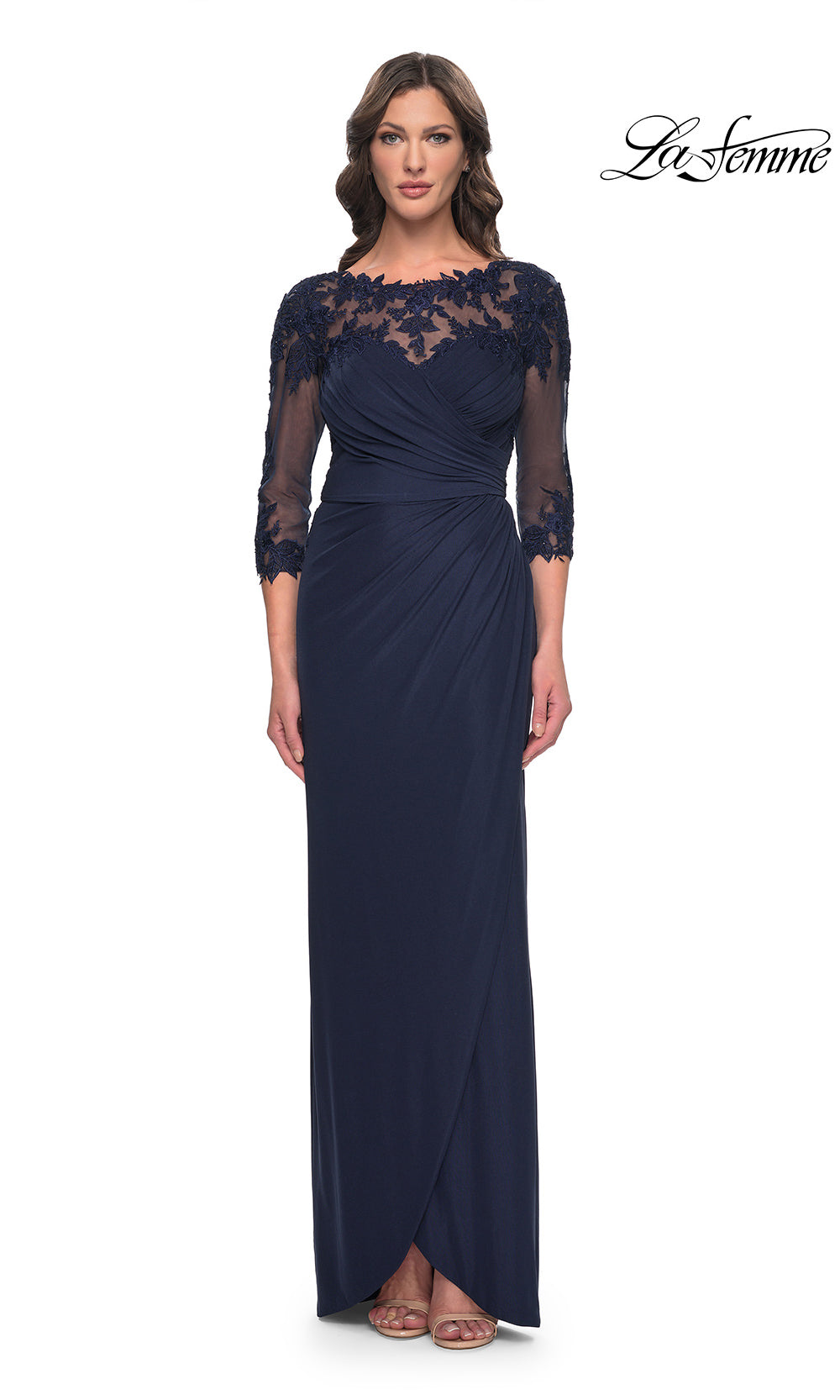 Navy blue evening gown with lace detailing on a white background