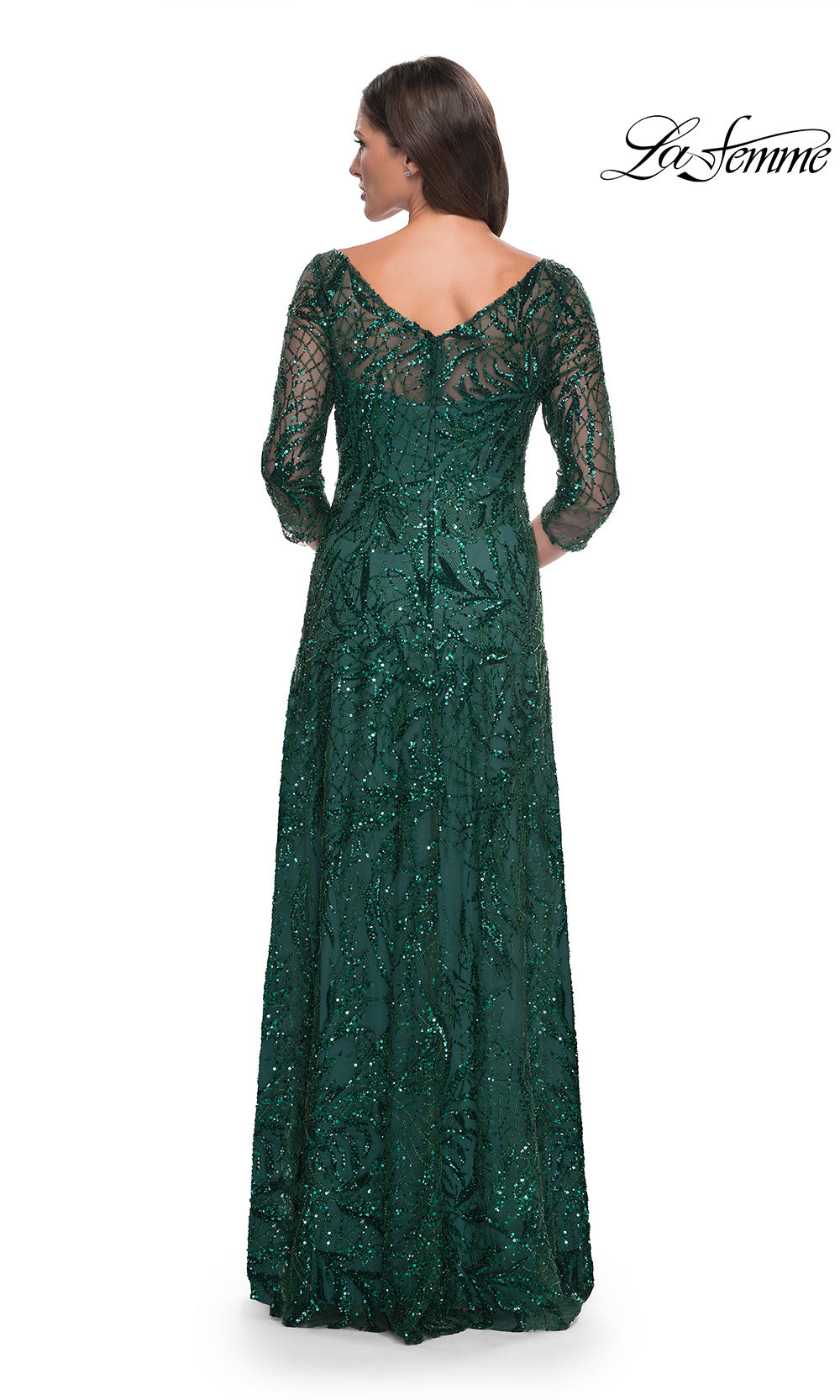 Green lace evening gown on a white background with 'La Femme' branding.