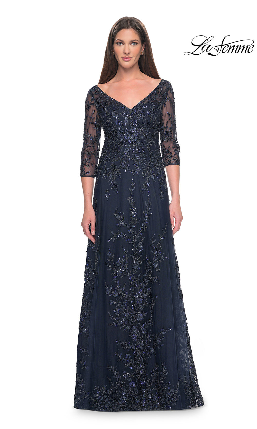 Navy blue lace evening gown with sheer sleeves on a white background