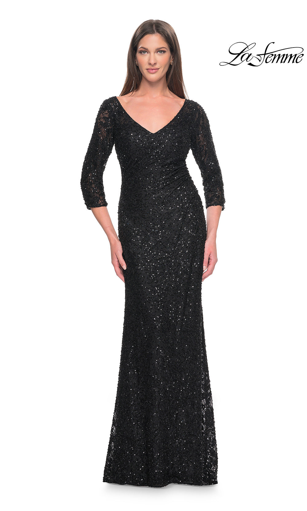 Woman wearing a black sequin evening gown on a white background