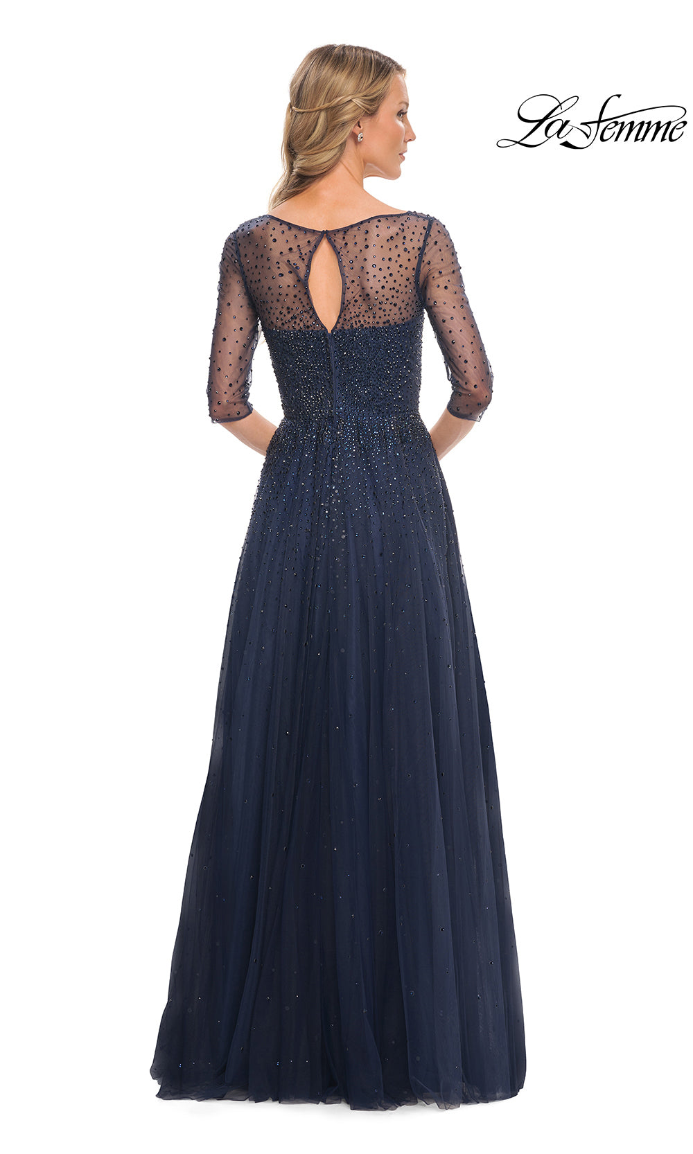 Navy blue evening gown with sheer sleeves on a white background