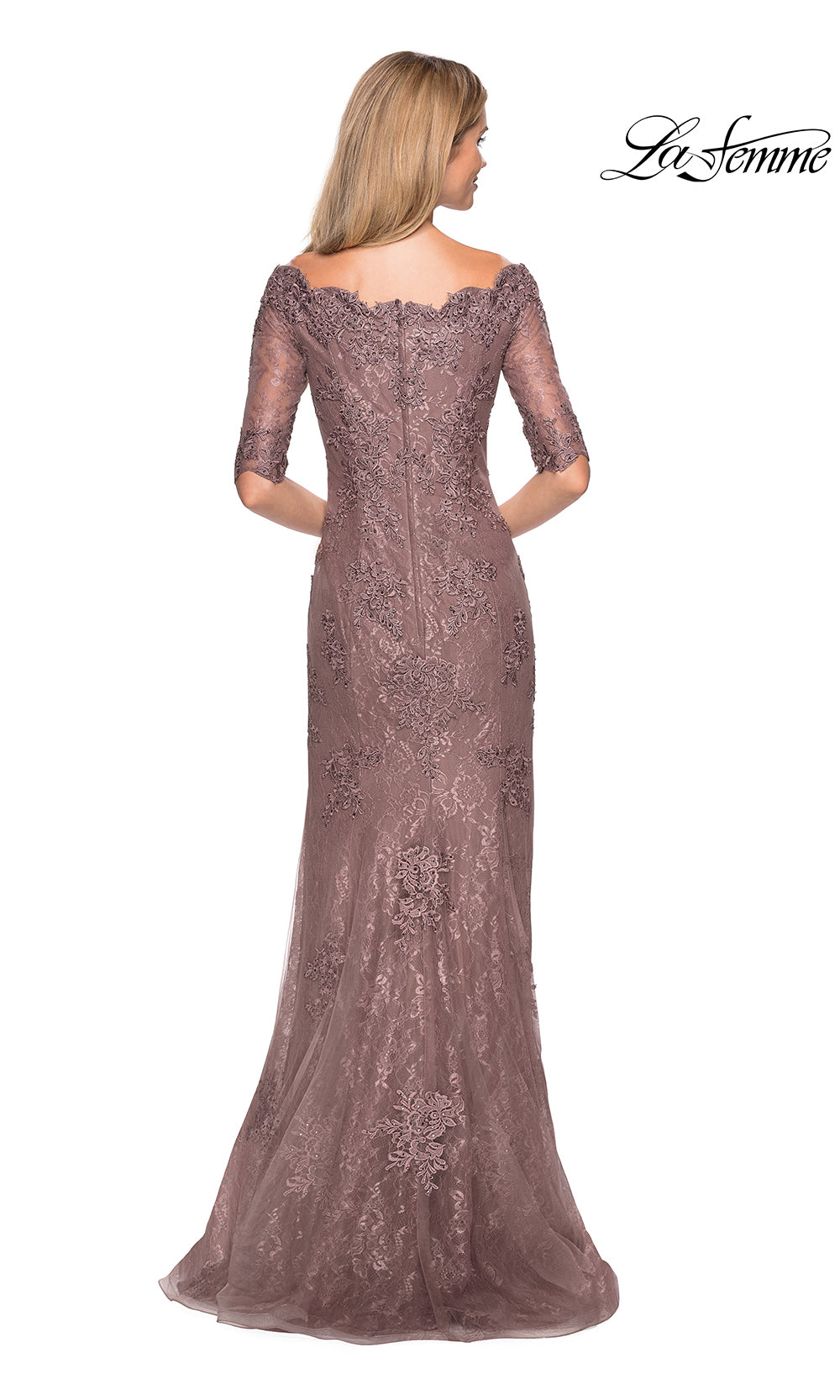 Long, elegant dress with lace detailing on a white background