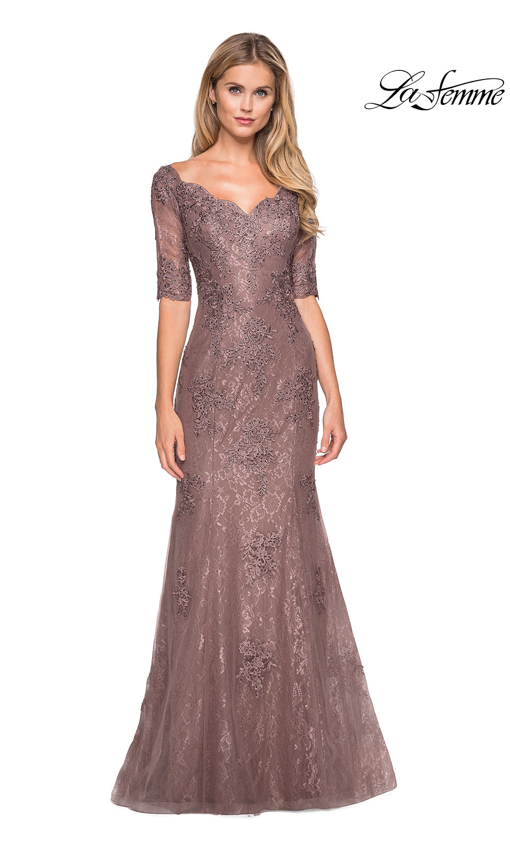 Woman wearing a sparkly evening gown with a white background