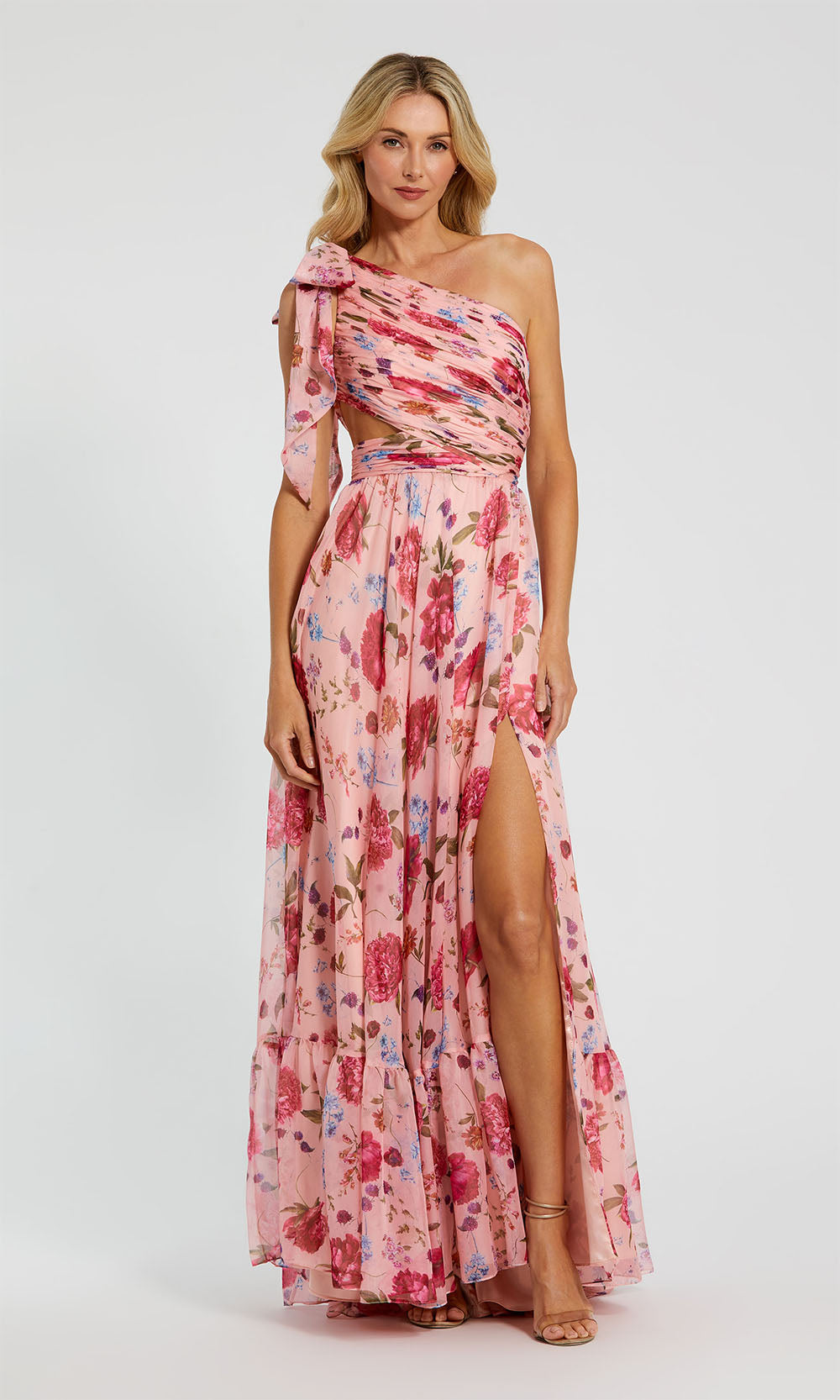Mac Duggal 68553 Blush Pink Multicolor front view one-shoulder floral chiffon a-line prom gown with bow strap, waist cut-out, and tiered ruffle hem, formal prom gown