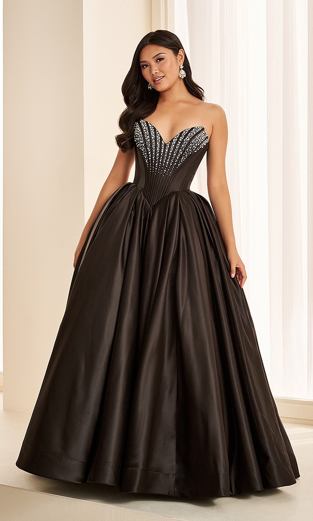 Ellie Wilde EW38020 Black White prom dress front view with beaded satin, strapless sweetheart neckline, ballgown silhouette, striking prom night look.