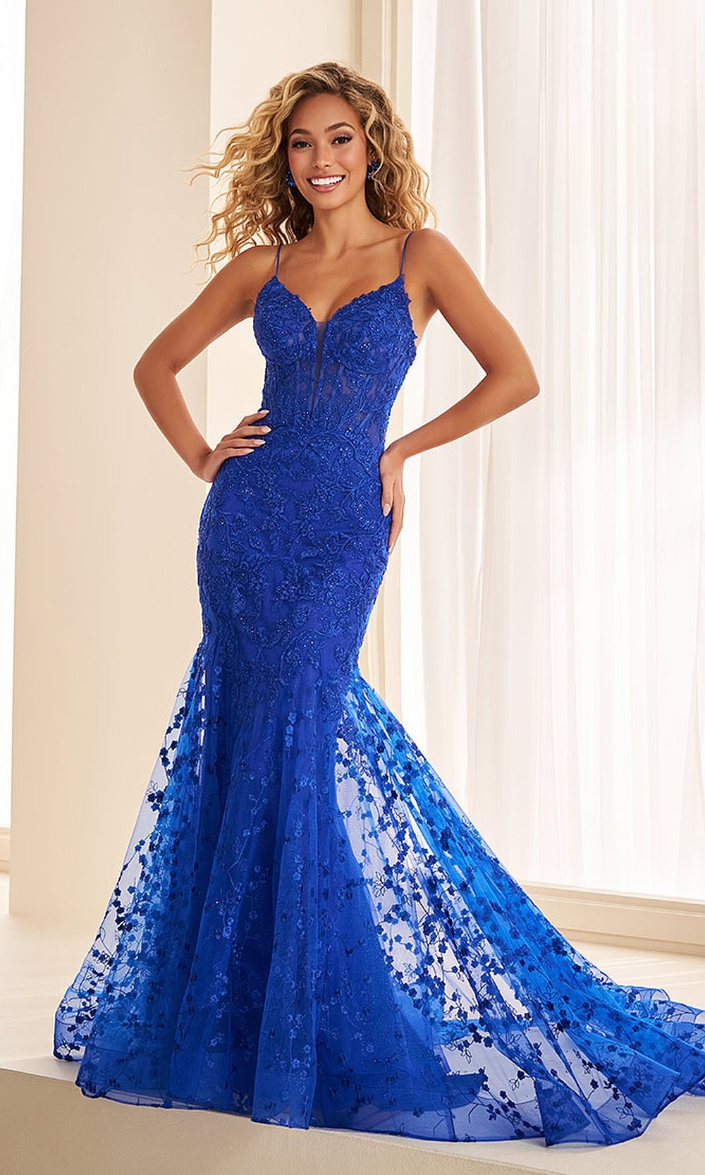 Ellie Wilde EW38076 Royal Blue front view prom dress with beaded lace, 3D floral appliqués, sheer mermaid corset silhouette, formal prom gown