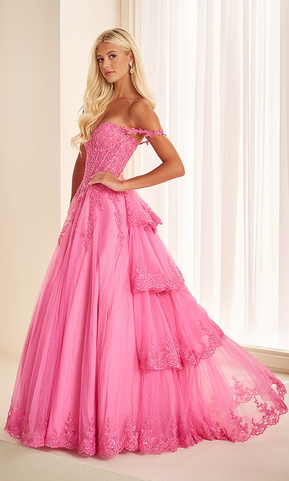 Ellie Wilde EW38092 Hot Pink prom dress front view with glitter tulle, lace floral appliques, sweetheart neckline, and tiered ballgown silhouette for a stunning gala gown.