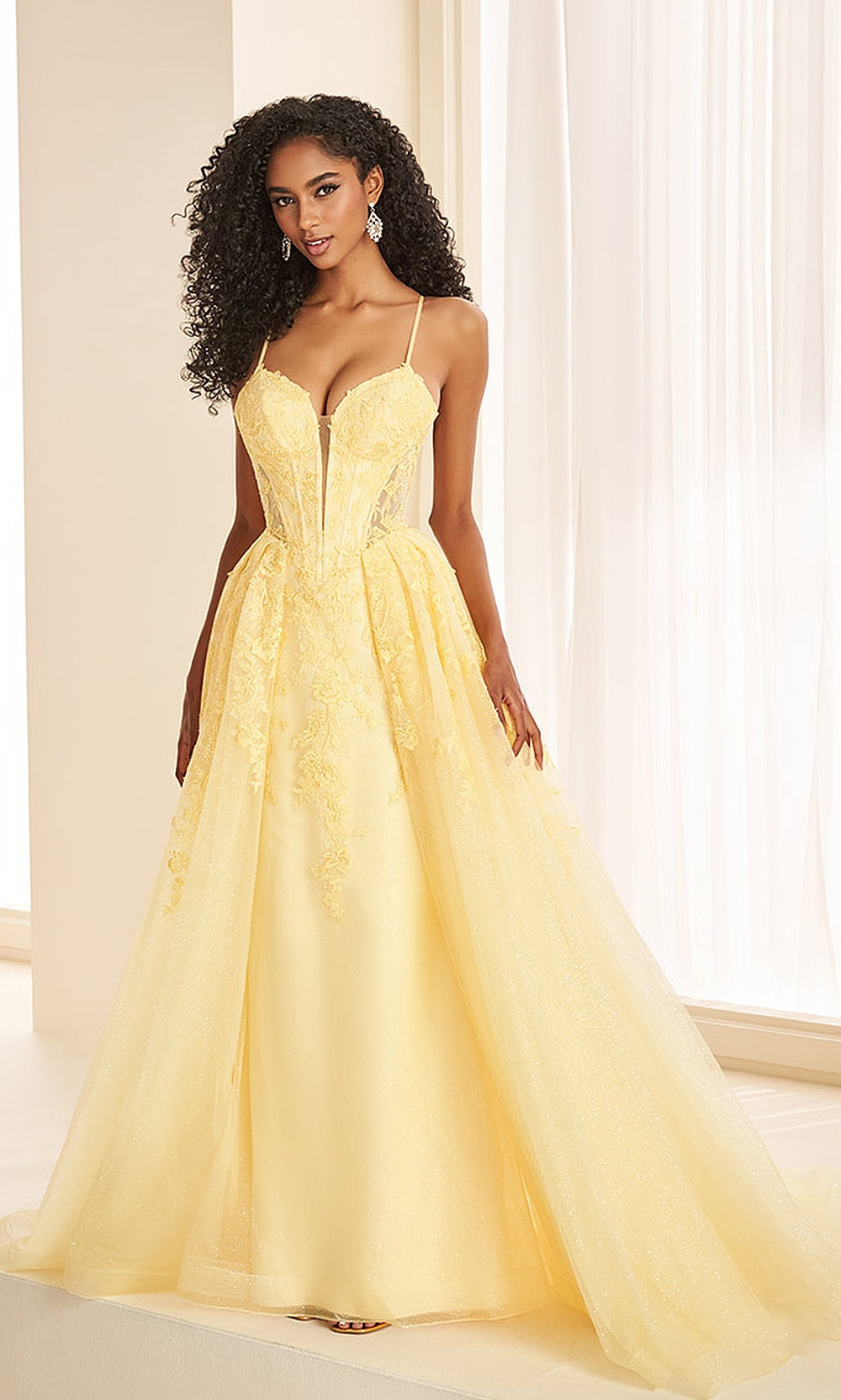 Ellie Wilde EW38095 Yellow prom dress front view with glitter tulle and lace, floral appliqués, sweetheart corset ballgown, formal prom gown.