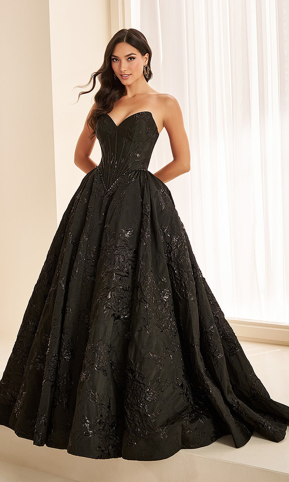 Ellie Wilde EW38100 Black prom dress front view with jacquard print fabric, strapless sweetheart neckline, beaded corset bodice, and full ballgown silhouette, evening gown.