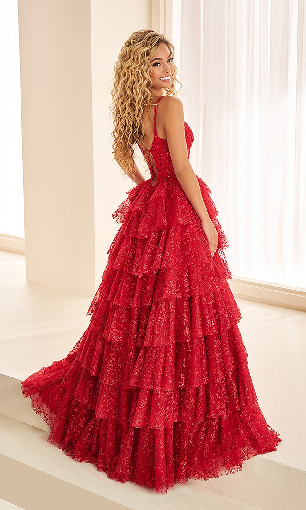 Ellie Wilde EW38101 Dark Red prom dress back view with lace and tulle, corset back closure, sweetheart ballgown with train and tiered ruffle skirt, evening gown.