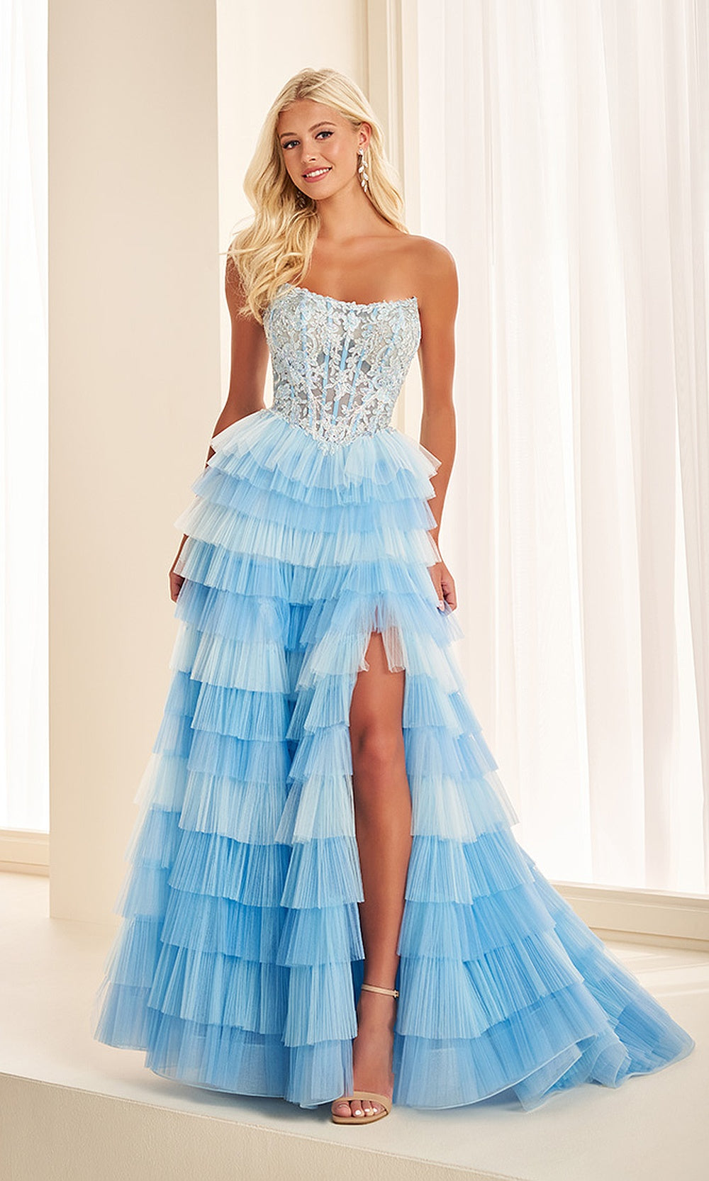 Ellie Wilde EW38126 Light Blue strapless lace corset prom dress front view with tulle, floral appliques, boned bodice, A-line silhouette, pageant-ready gown.