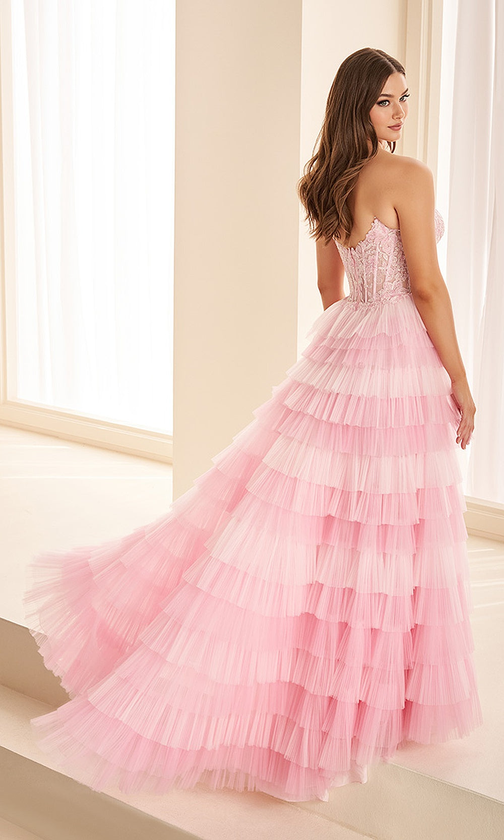 Ellie Wilde EW38126 Light Pink strapless lace corset prom dress back view with tiered tulle skirt, floral appliques, high slit, evening gown.