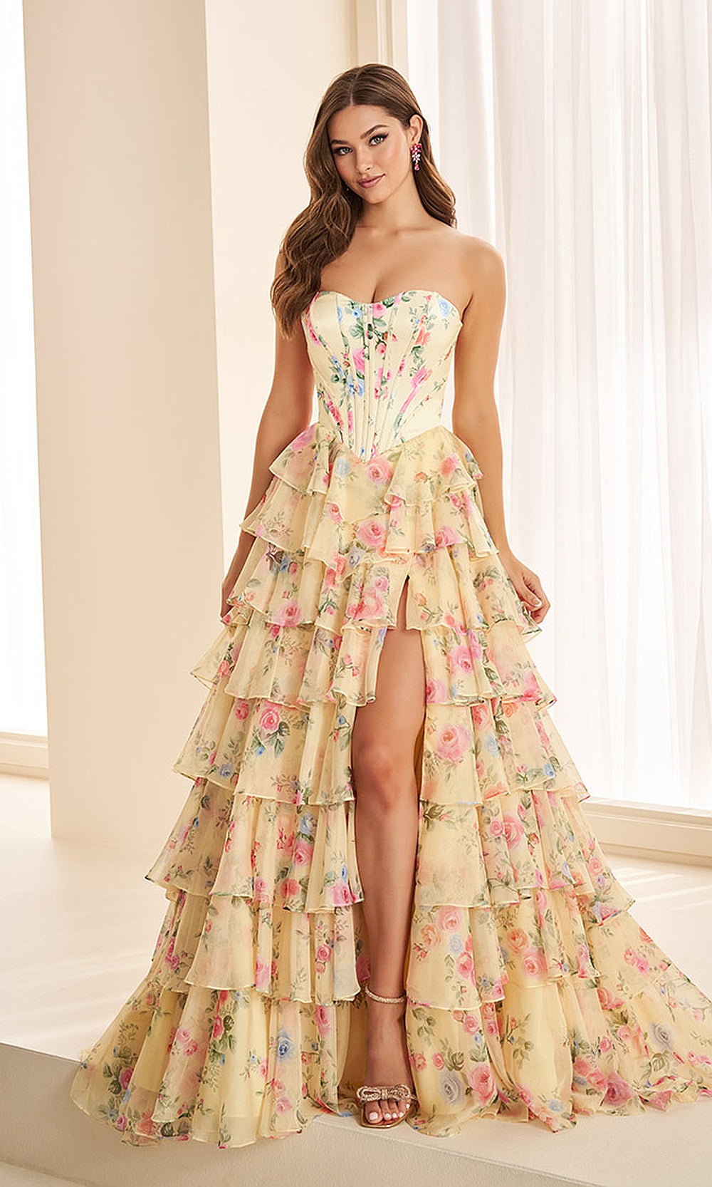 Ellie Wilde EW38127 Yellow Multi prom dress front view with chiffon print, sweetheart neckline, tiered ruffle ballgown silhouette, a stunning formal prom gown.