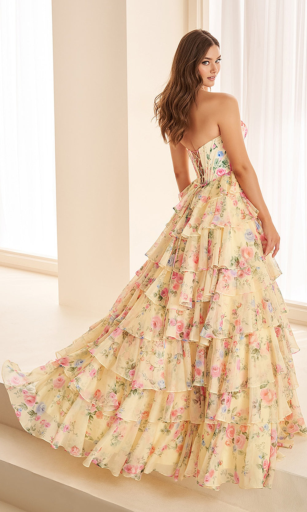 Ellie Wilde EW38127 Yellow Multi prom dress back view with chiffon print, corset back, tiered ruffle ballgown silhouette, an elegant evening gown.