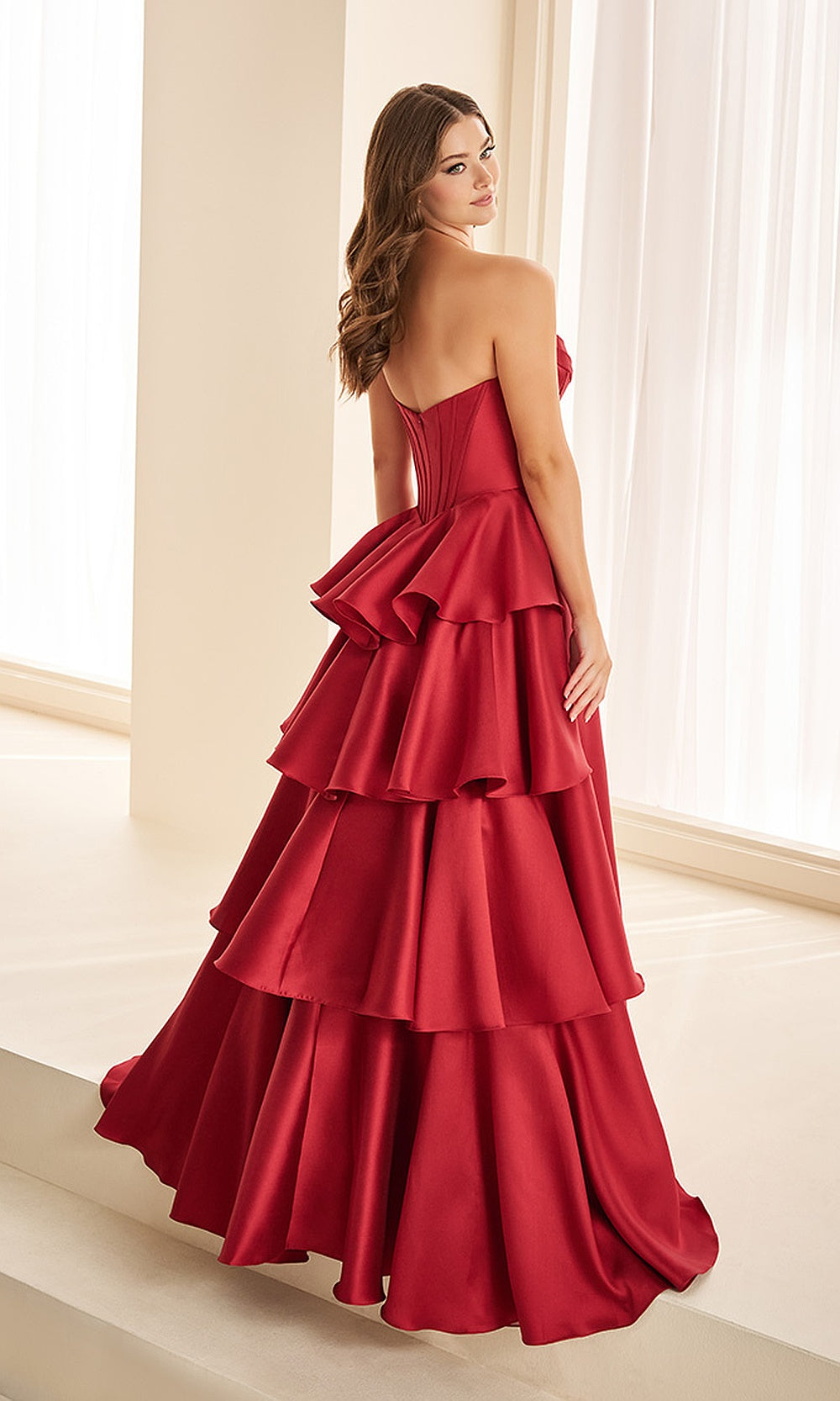 Ellie Wilde EW38137 Wine strapless prom dress back view with satin fabric, open-back corset lacing, ballgown silhouette, evening gown.