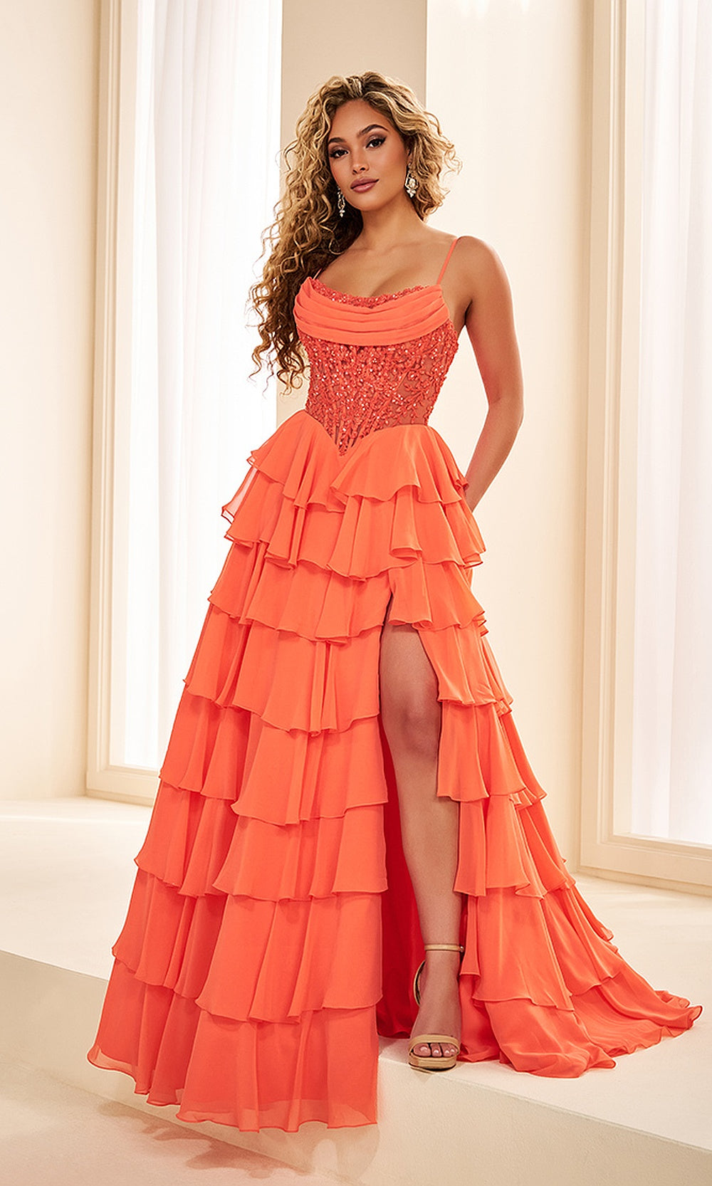 Ellie Wilde EW38201 Vermillion Orange prom dress front view with chiffon and sequin, beaded corset and ruffle skirt, A-line silhouette, gala gown.
