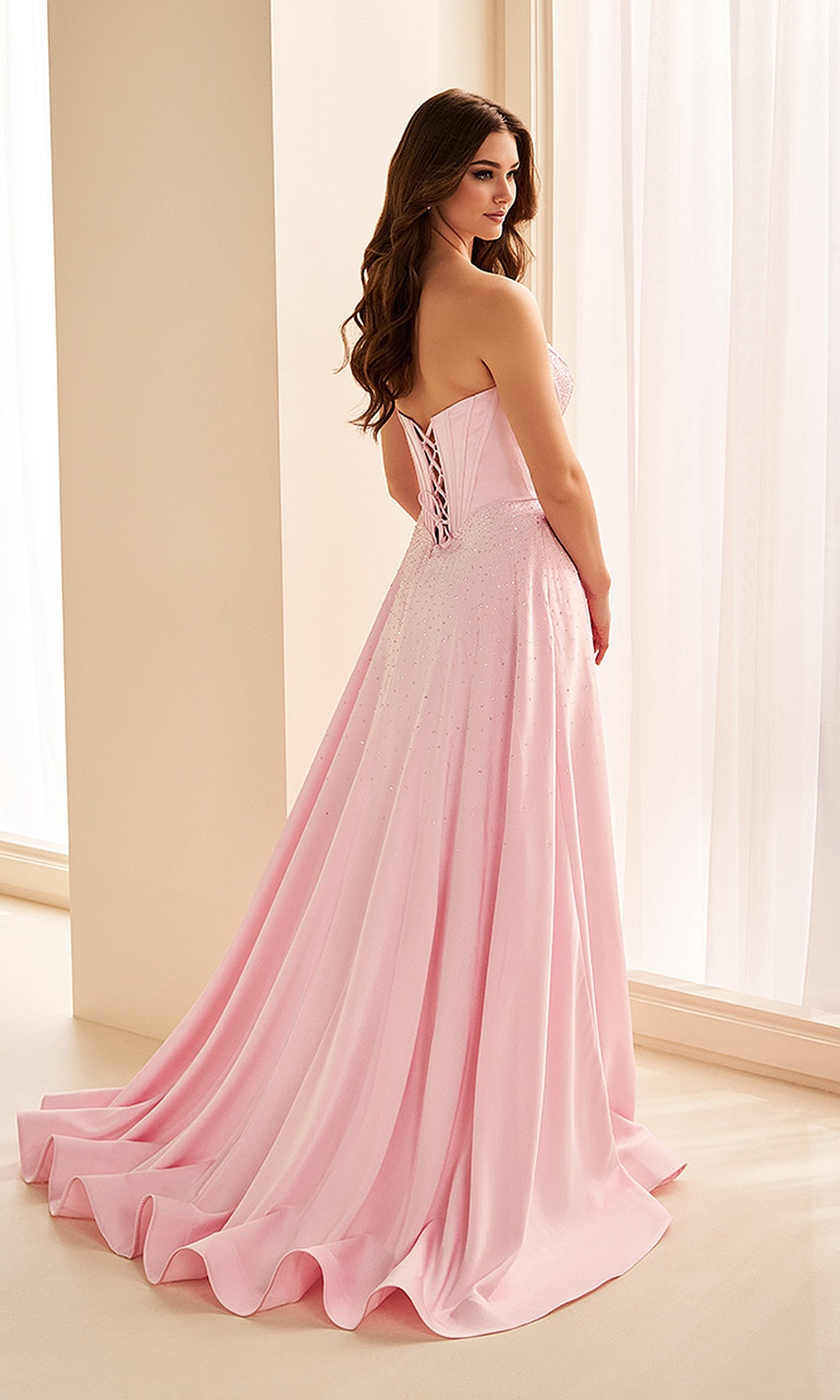 Ellie Wilde EW38207 Light Pink strapless sweetheart prom dress back view with satin fabric, corset-back lace-up closure, A-line ballgown silhouette, elegant evening gown with sweep train.