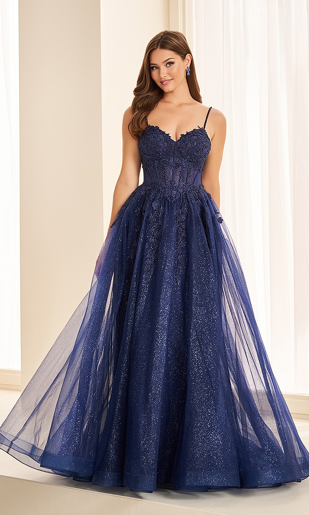 Ellie Wilde EW38217 Navy Blue front view prom dress with glitter tulle, lace appliqué corset, full A-line ballgown skirt, formal prom gown